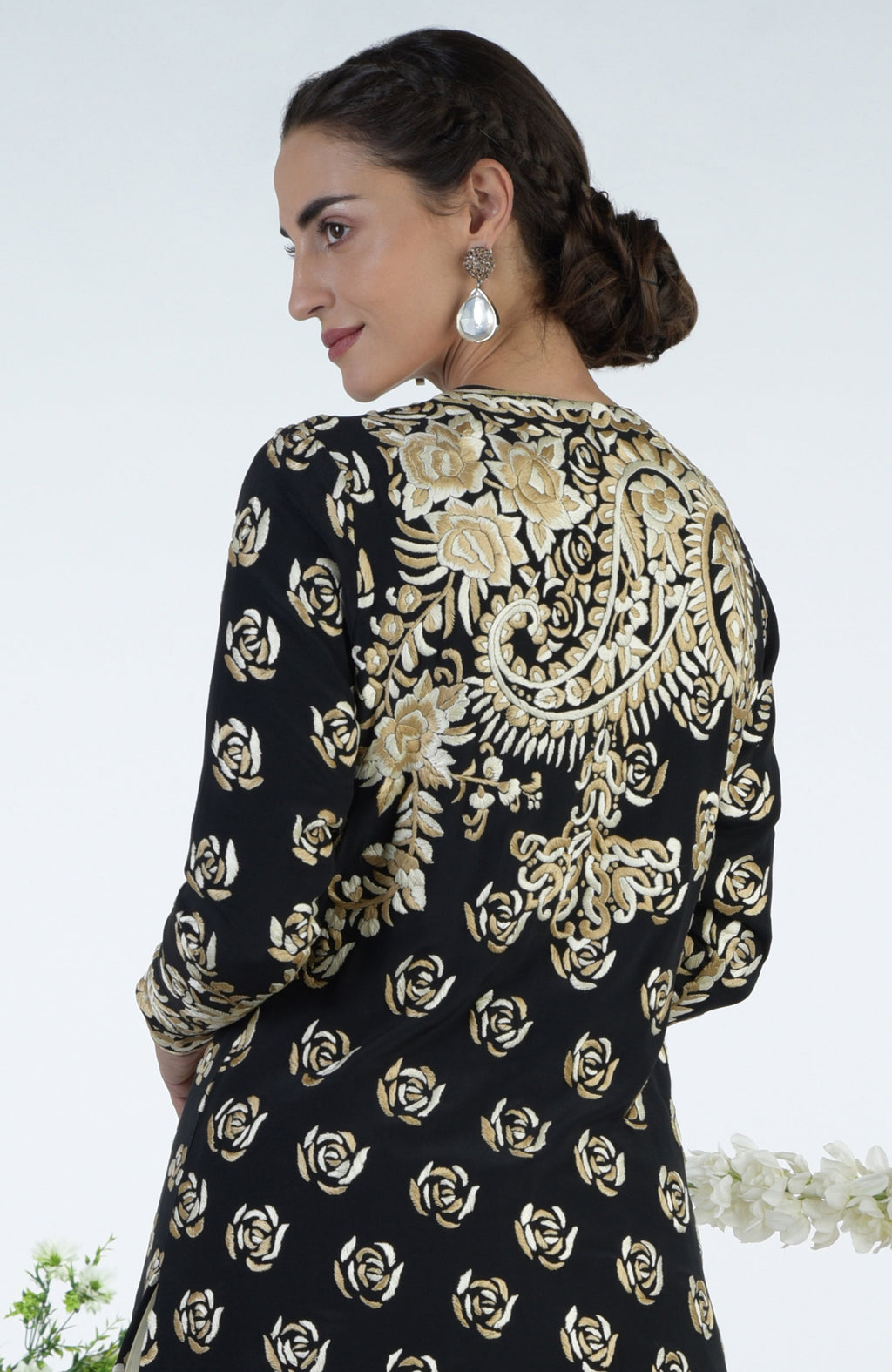 Black jacket with ivory and beige floral Parsi Gara embroidery paired with a full tulle skirt