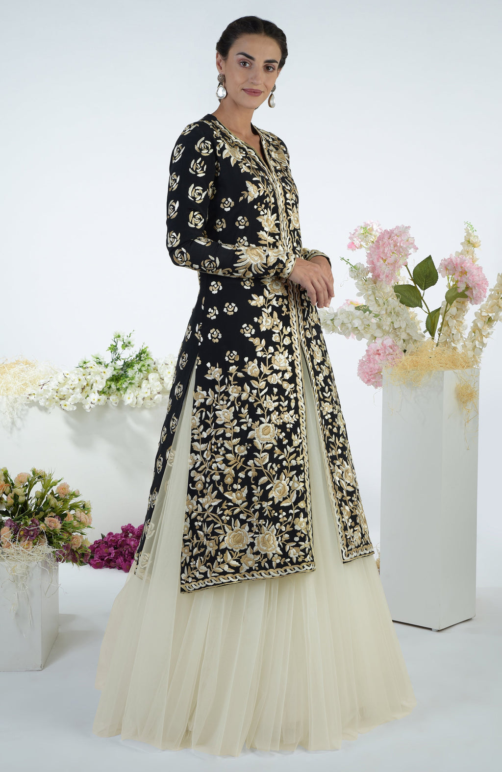 Black jacket with ivory and beige floral Parsi Gara embroidery paired with a full tulle skirt