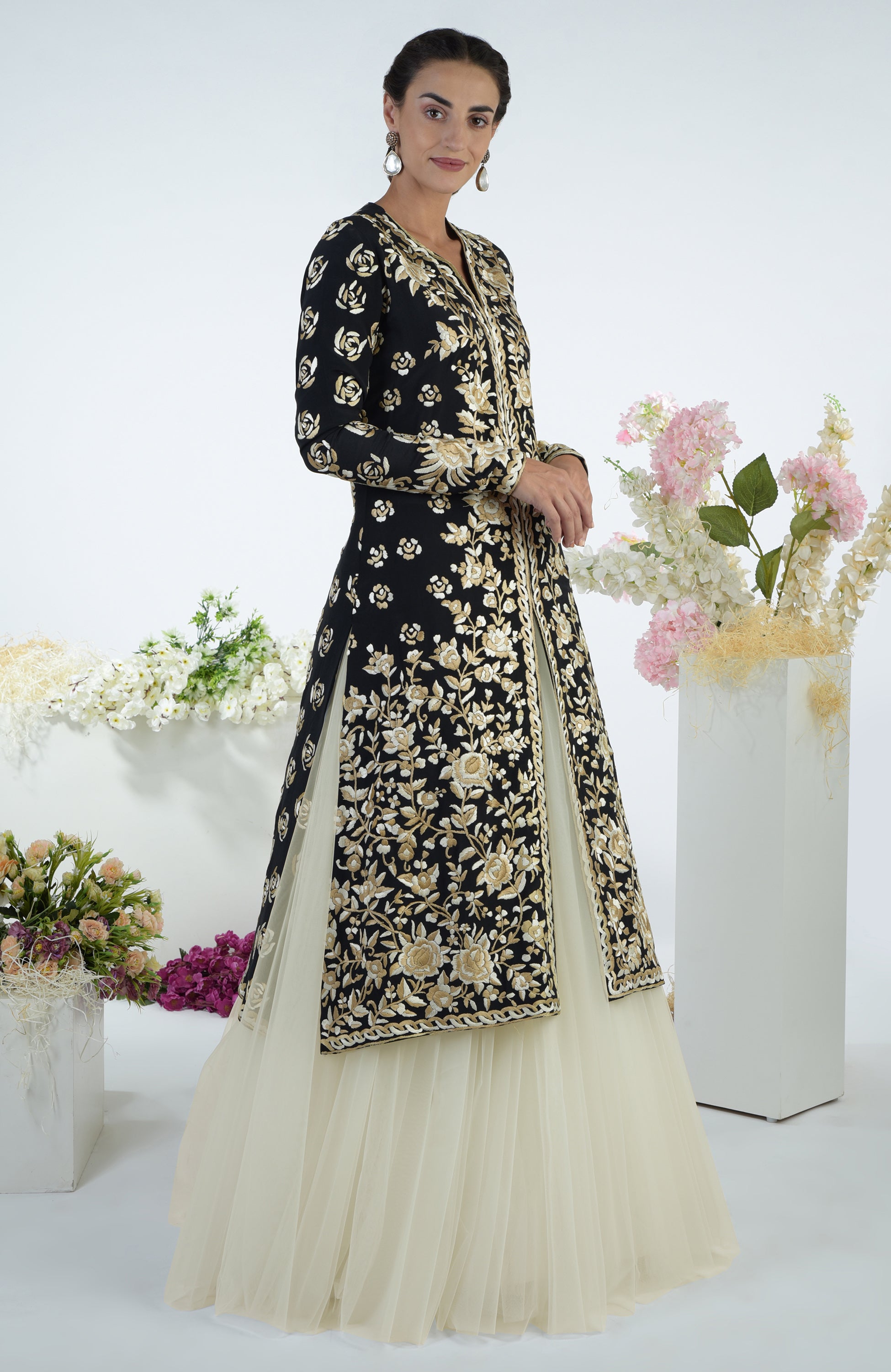 Black jacket with ivory and beige floral Parsi Gara embroidery paired with a full tulle skirt