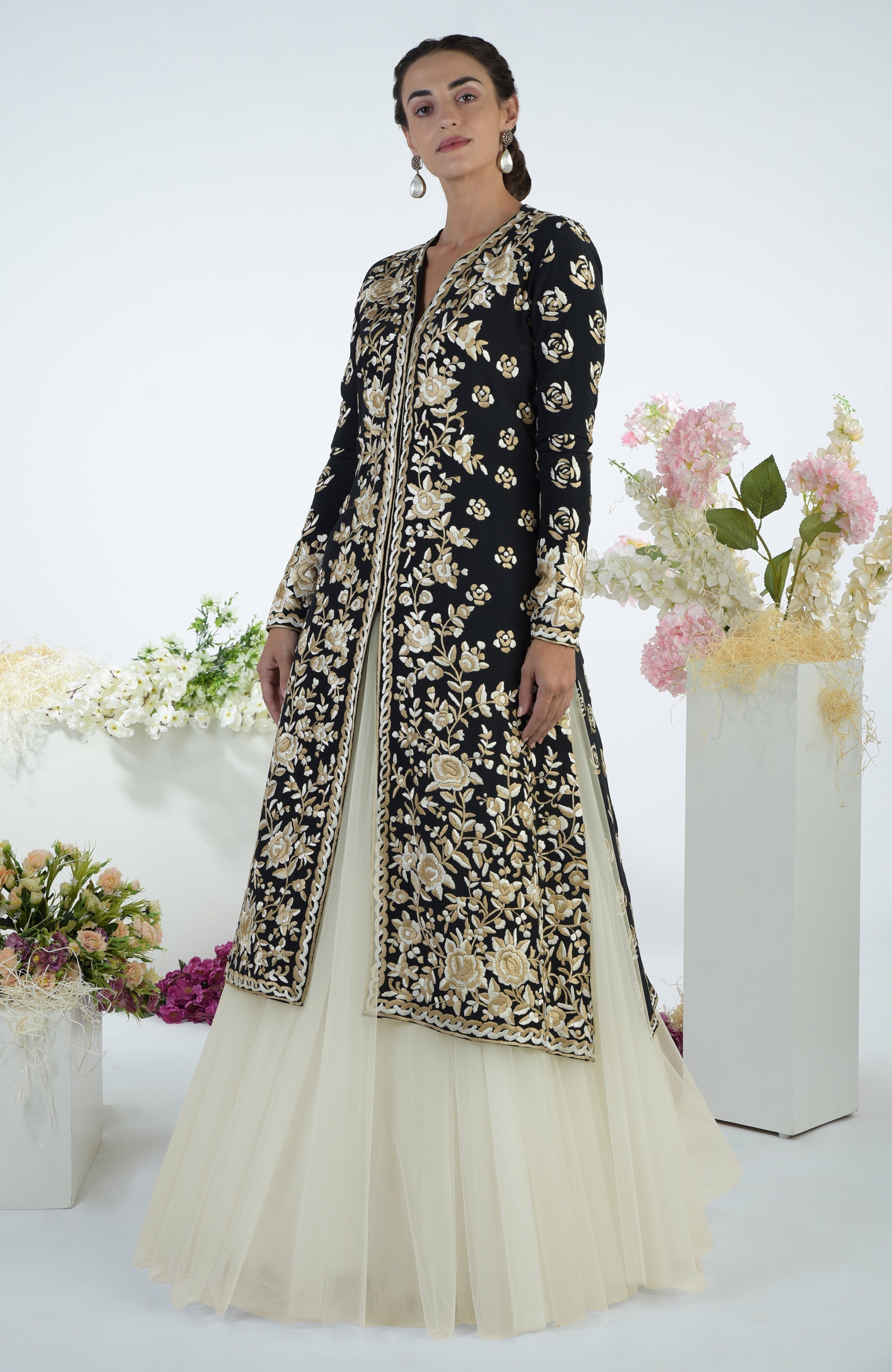 Black jacket with ivory floral Parsi Gara embroidery paired with a full volume tulle skirt