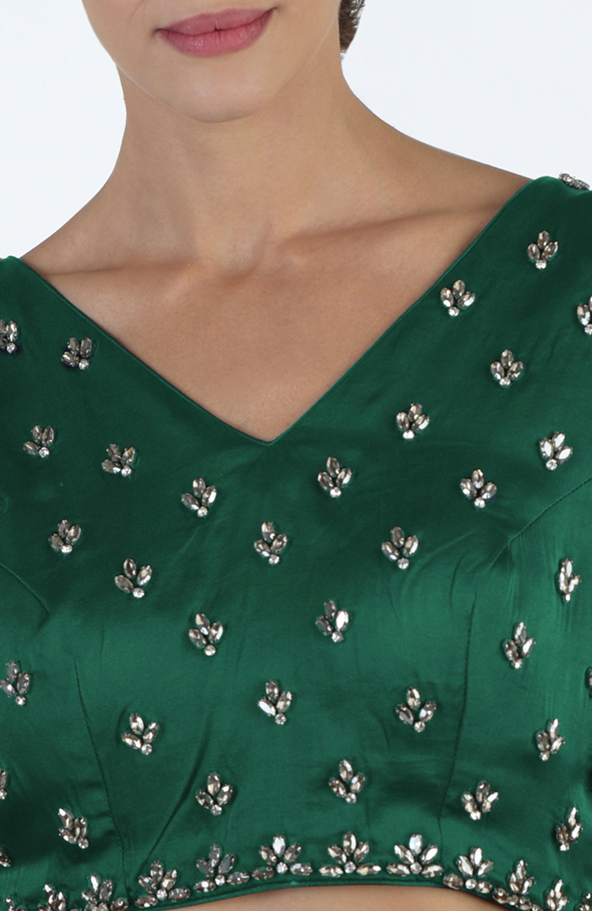 Emerald green blouse with crystal hand embroidery and a V-neckline.