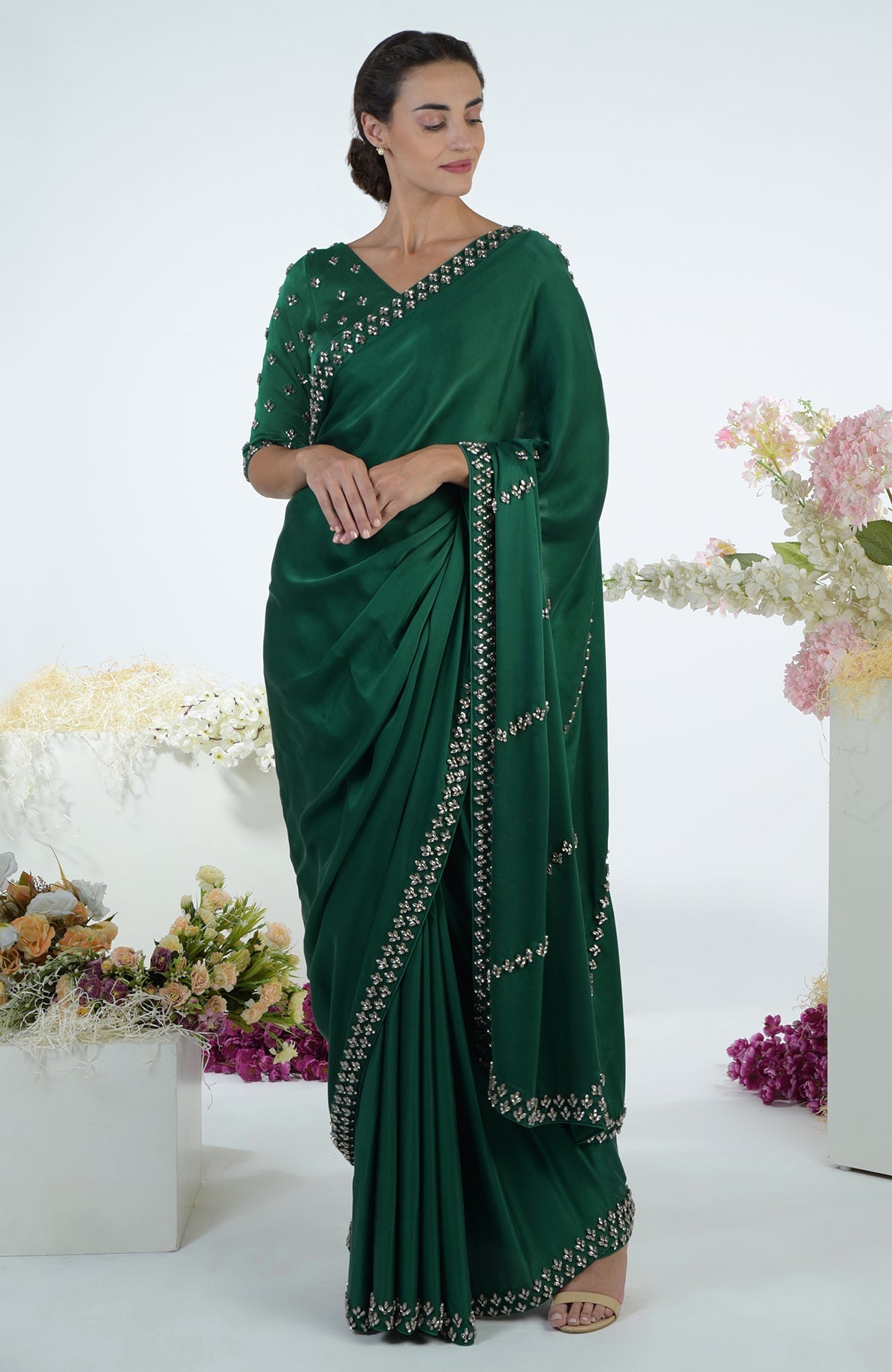 Emerald green crystal hand embroidered saree and blouse.