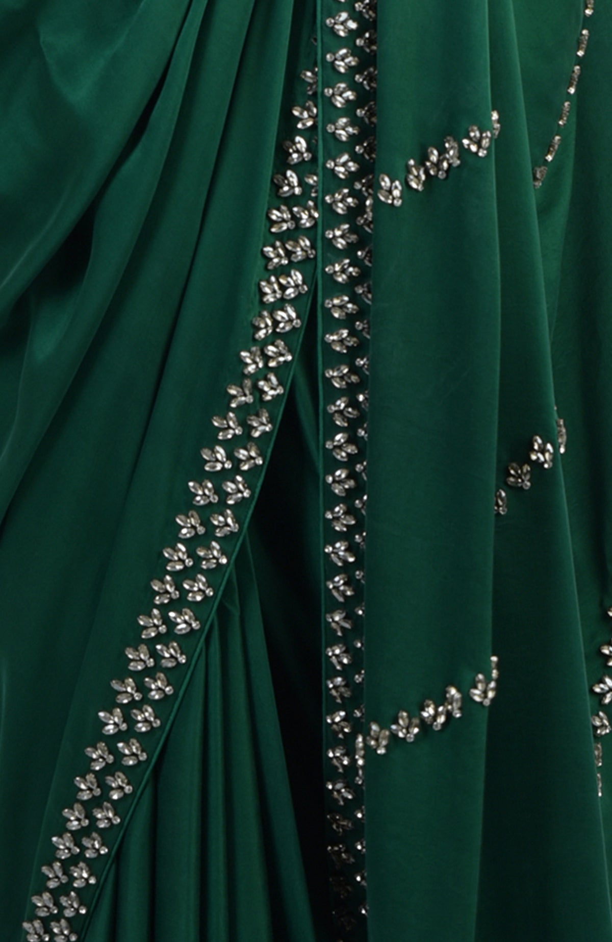 Emerald green satin crepe saree with crystal hand embroidery.