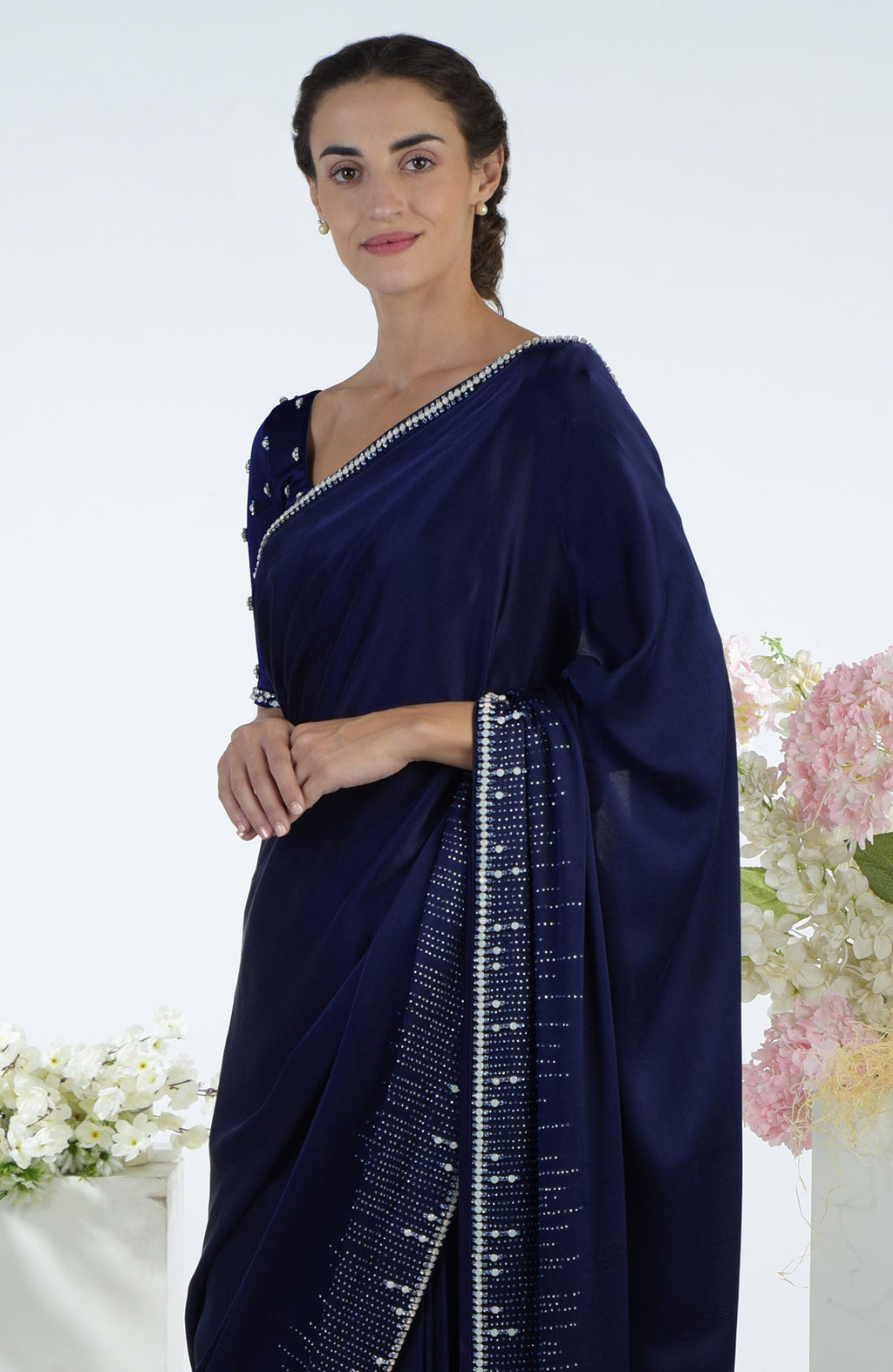 Midnight Sky crystal hand embroidered saree and blouse on a woman.