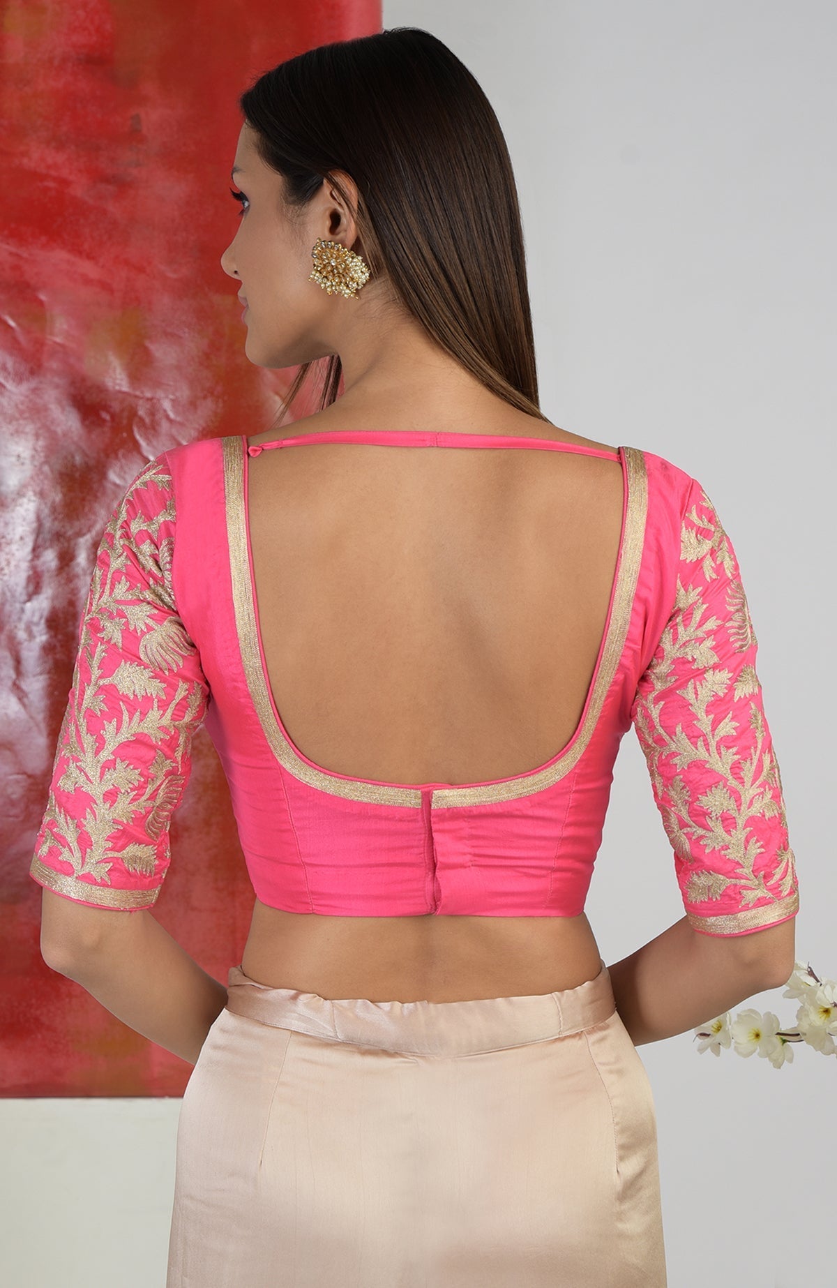 Fuchsia zari embroidered sweetheart blouse with a deep back and elbow-length sleeves.