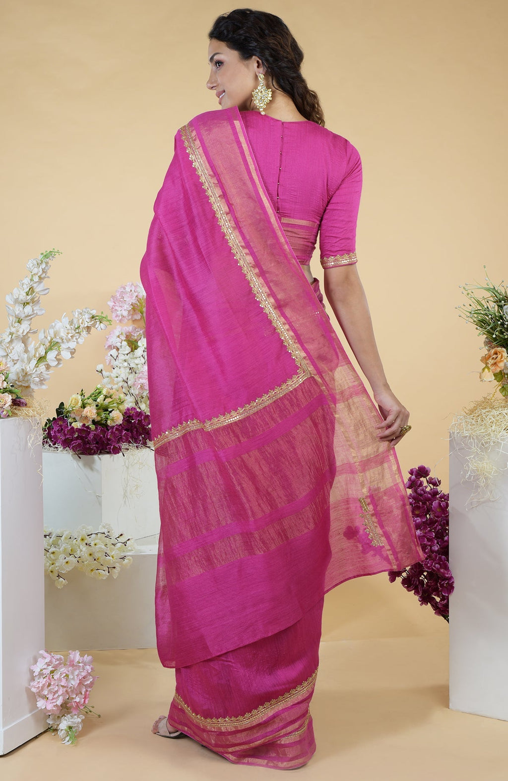 Raspberry Zardozi Hand Embroidered Linen Saree with a matching blouse.