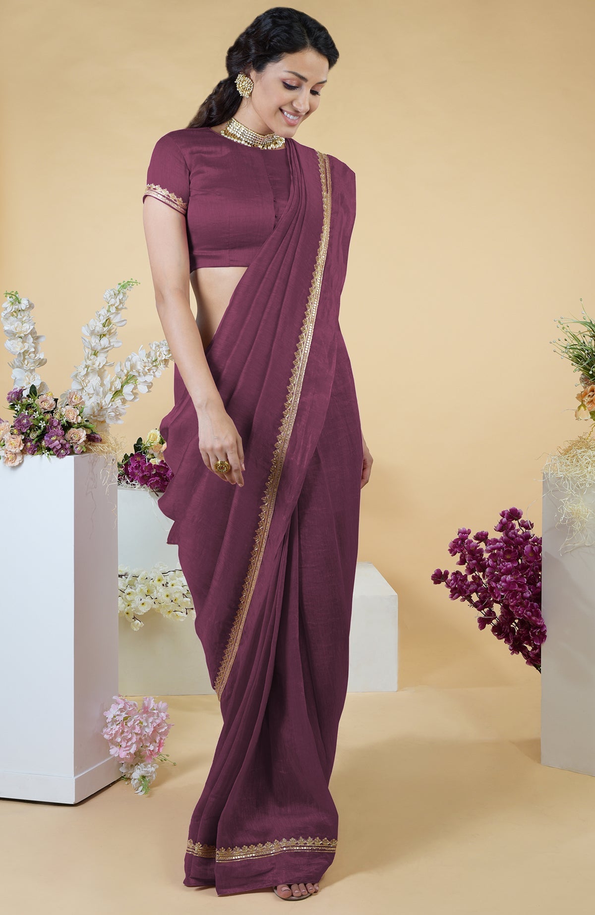 Burgundy purple linen saree with hand-embroidered gold zardozi work and matching blouse