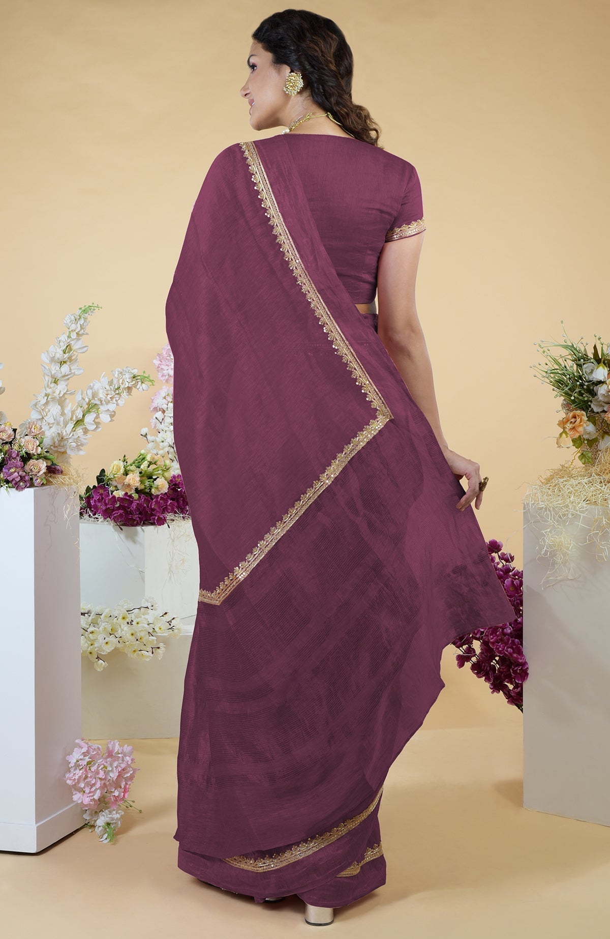 Burgundy purple linen saree with hand-embroidered gold zardozi work and matching blouse