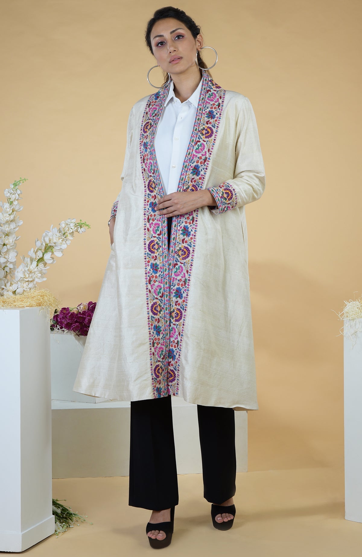 Ivory Kashmiri Kashidakari hand-embroidered kimono jacket with colorful floral patterns.