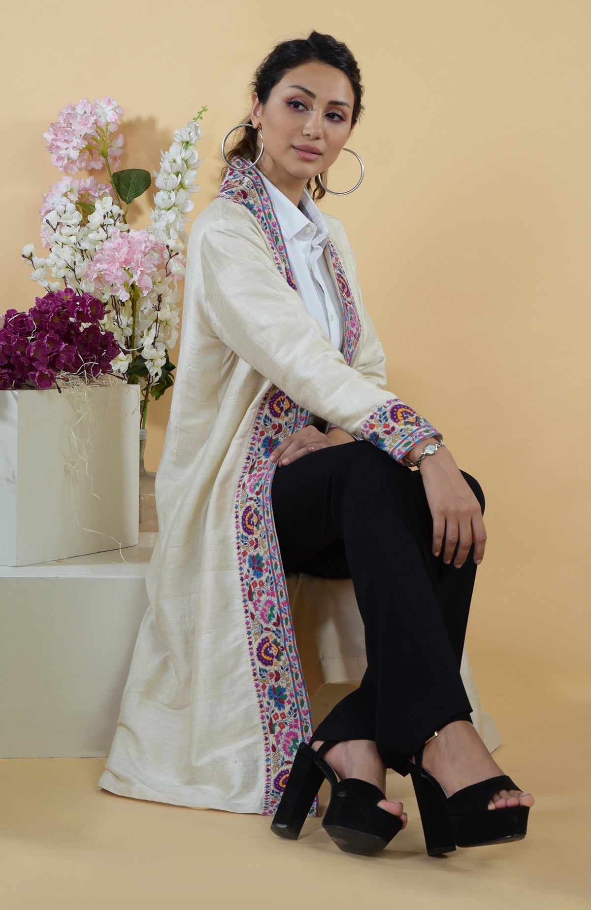 Ivory Kashmiri Kashidakari hand-embroidered kimono jacket with colorful floral borders.