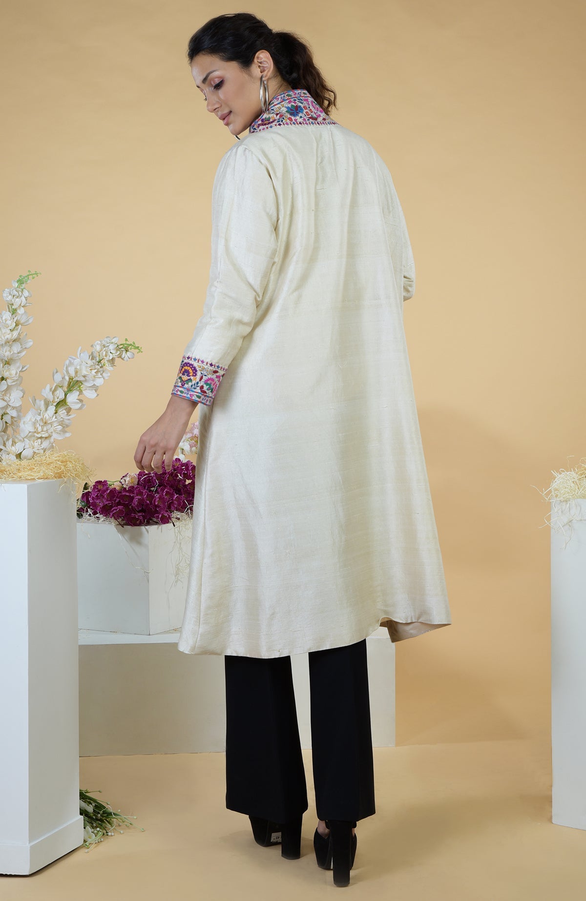 Ivory Kashmiri Kashidakari hand-embroidered kimono jacket with colorful floral patterns.