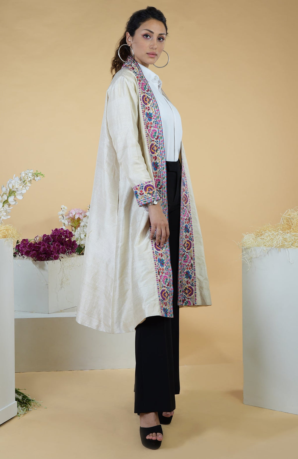 Ivory Kashmiri Kashidakari hand-embroidered kimono jacket with colorful floral borders.