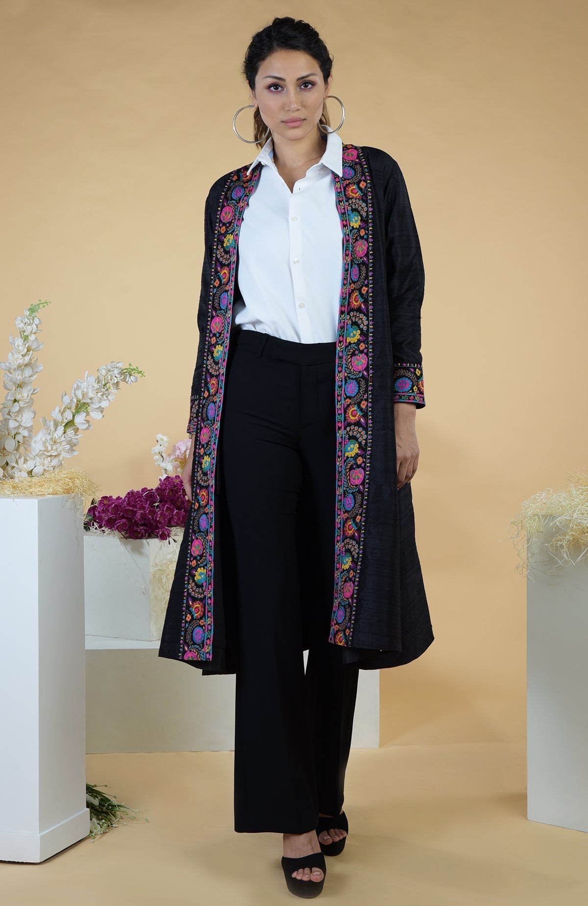 Black Kashmiri Kashidakari hand-embroidered kimono jacket with colorful floral patterns.