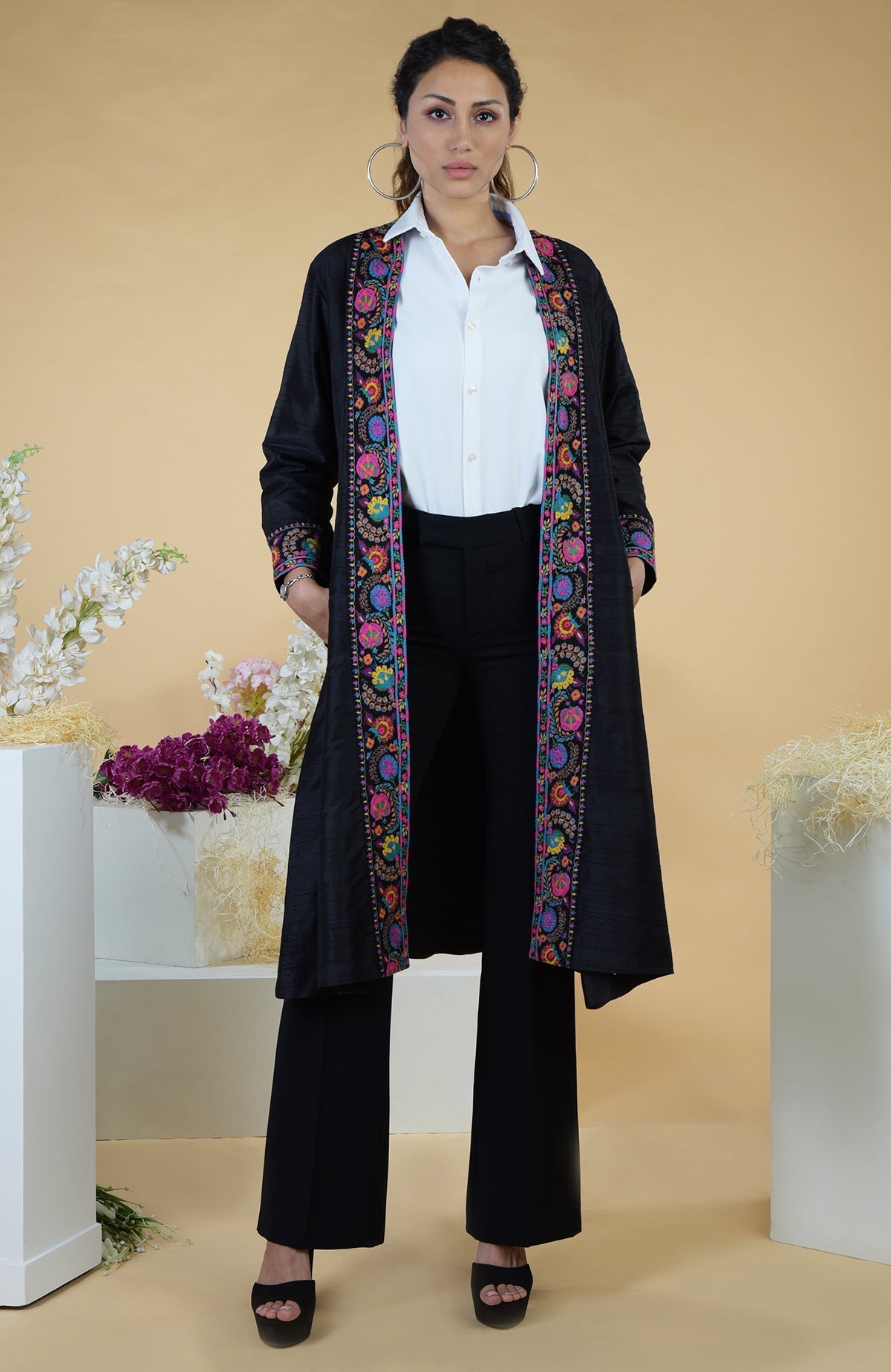 Black Kashmiri Kashidakari hand-embroidered kimono jacket with colorful floral patterns.