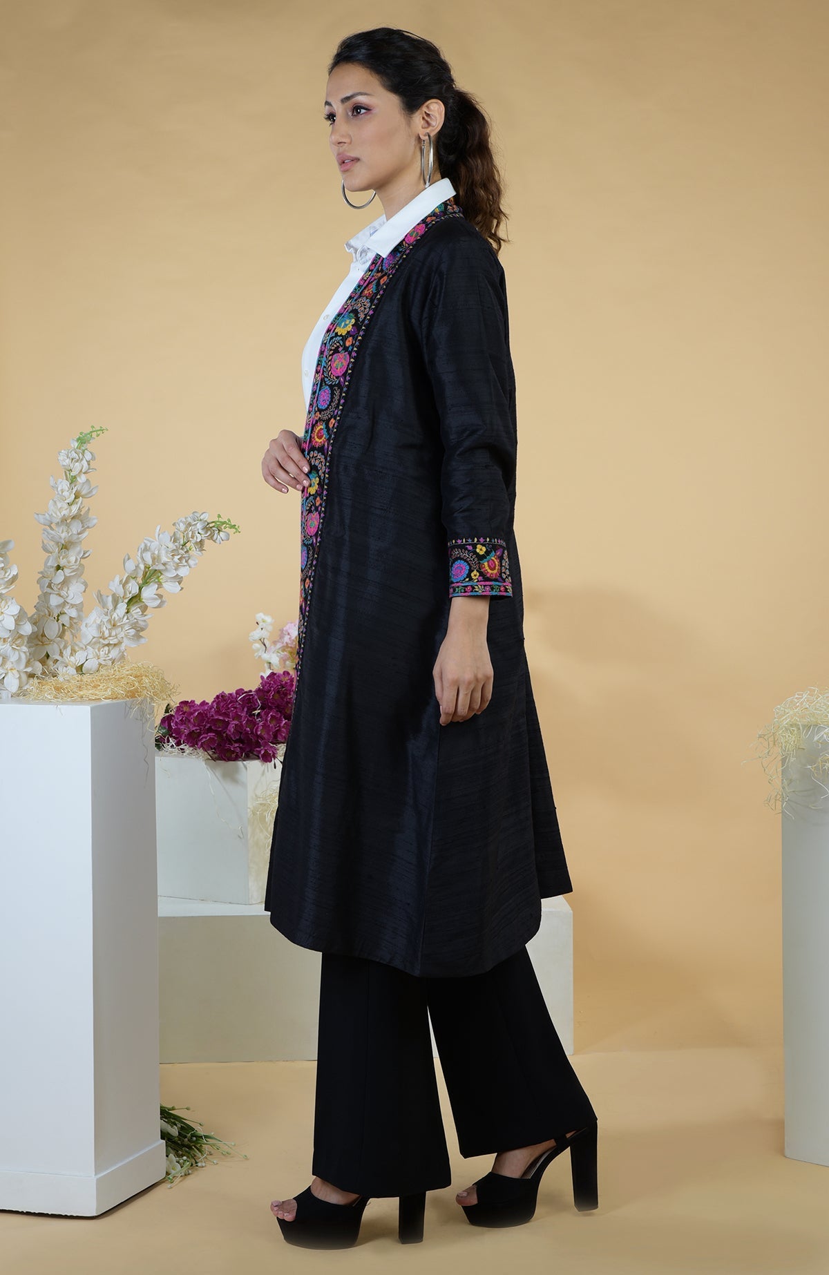 Black raw silk kimono jacket with colorful floral hand embroidery.