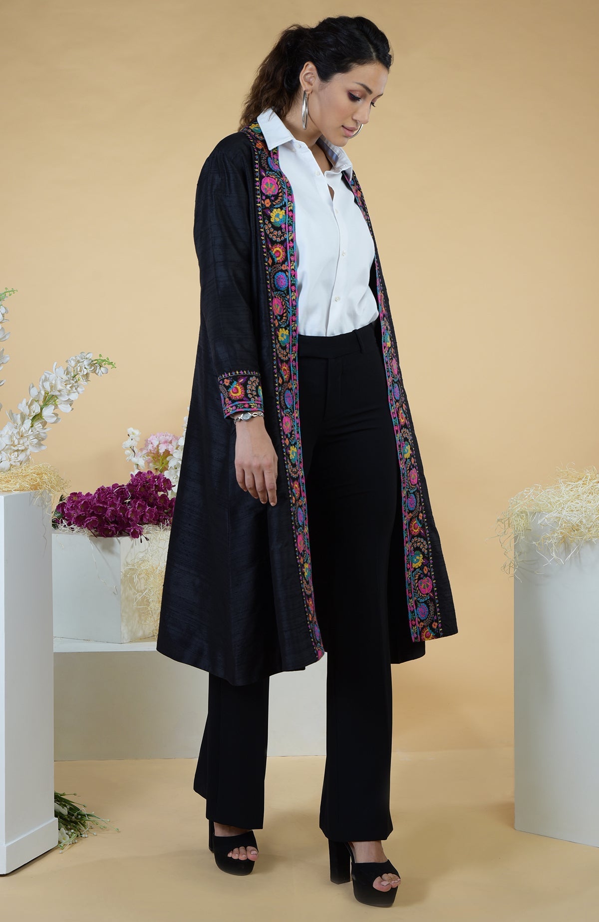 Black Kashmiri Kashidakari hand-embroidered kimono jacket with colorful floral borders.