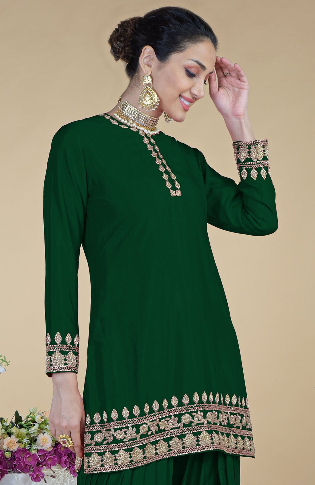 Emerald green salwar suit with gold zardozi hand embroidery.