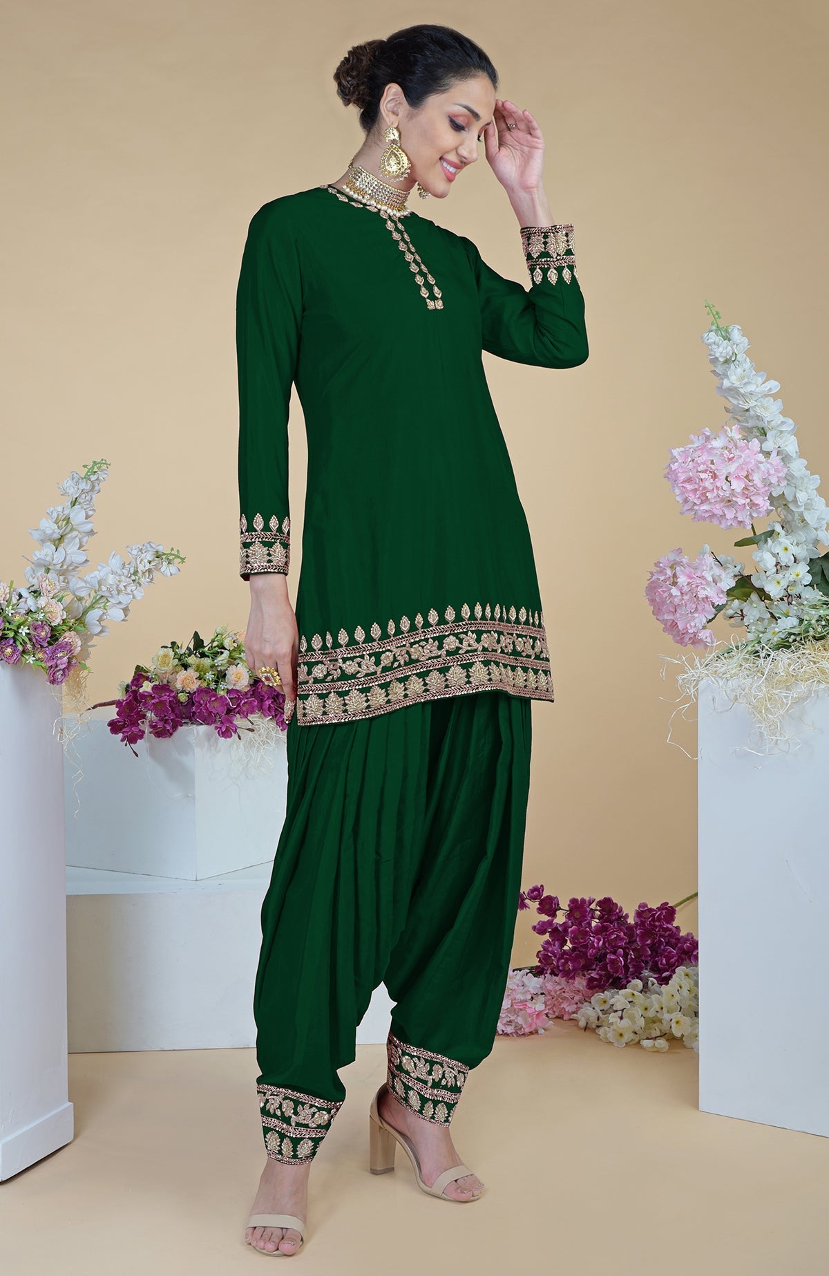 Emerald green salwar suit with gold zardozi hand embroidery.