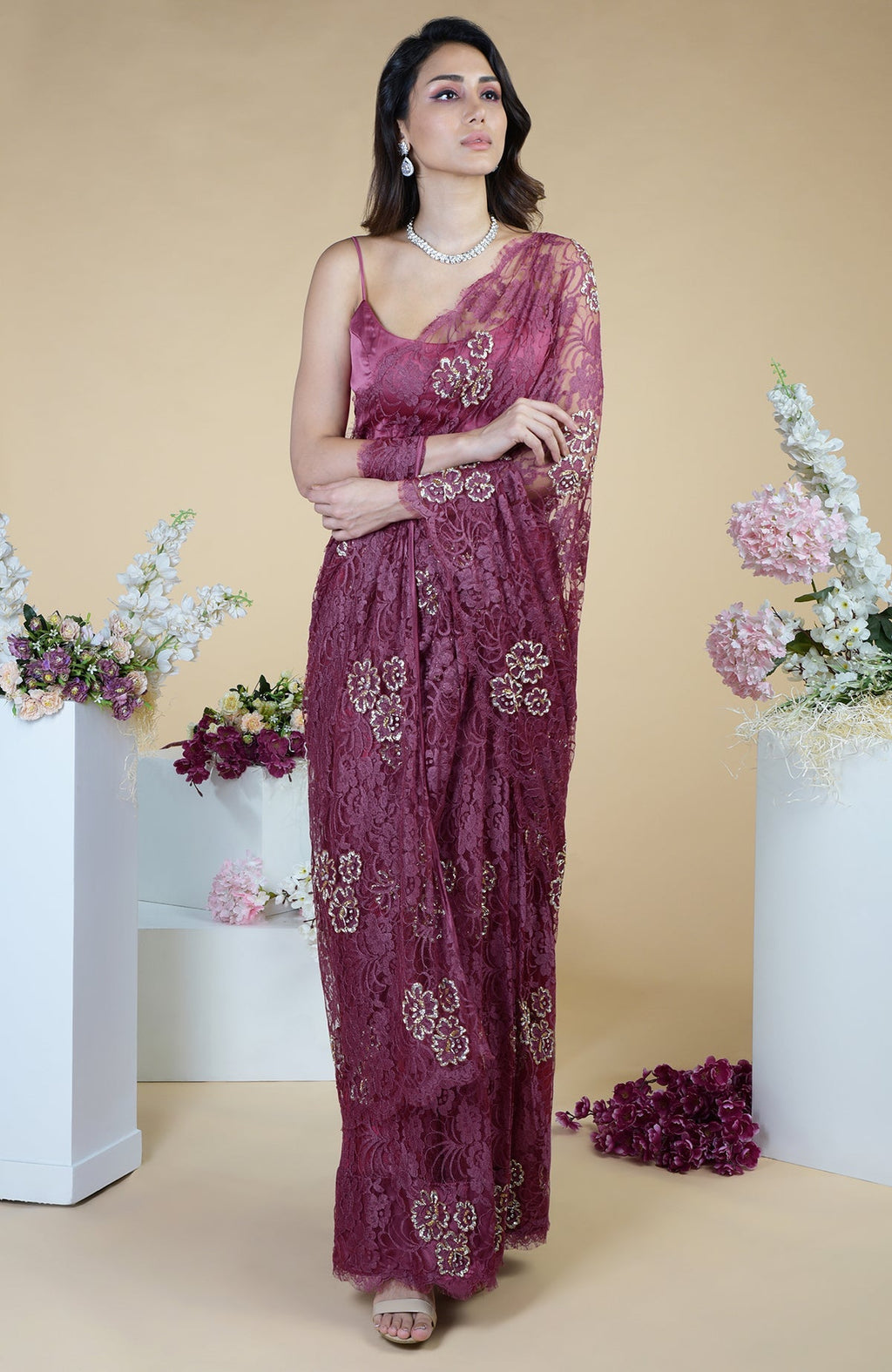 Wine French Chantilly saree with gold and silver hand embroidery.
