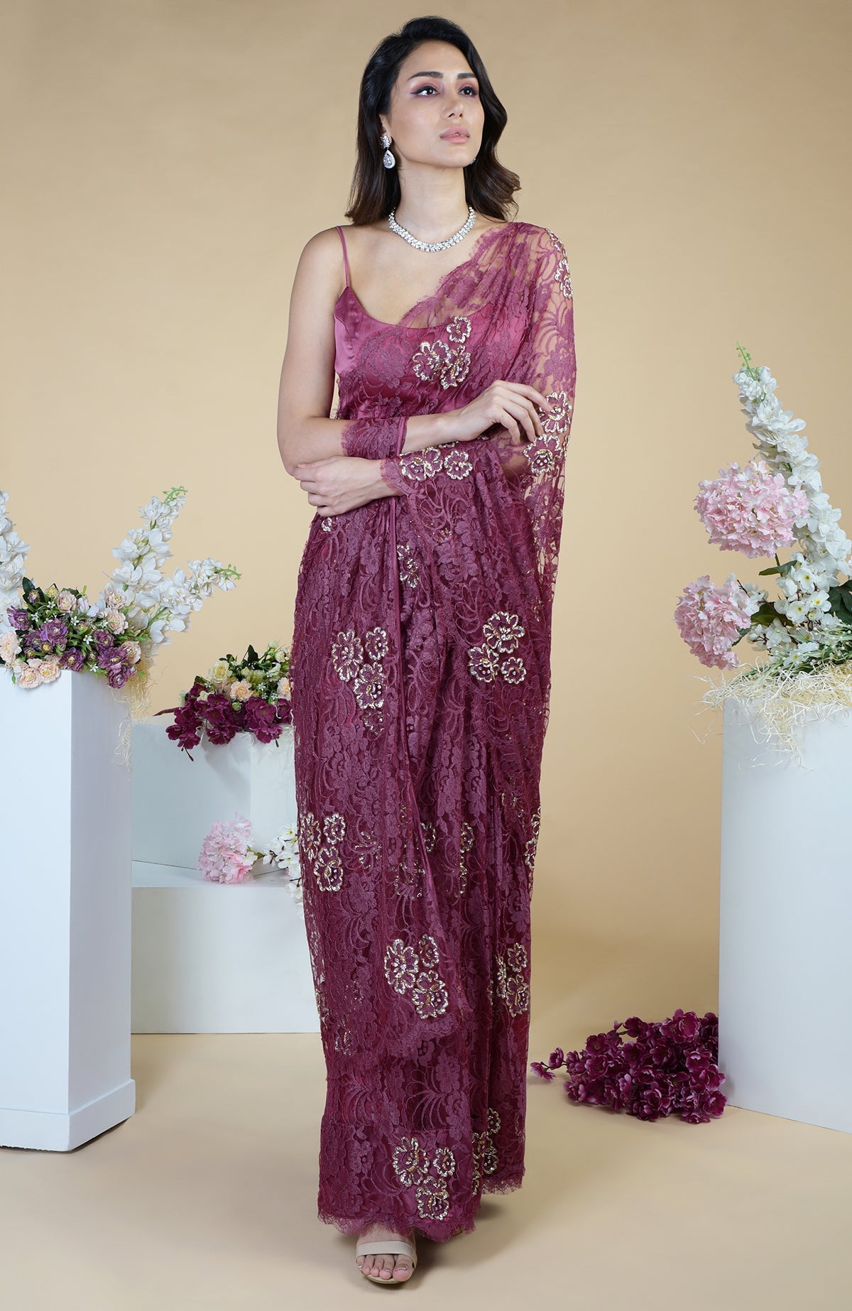 Wine French Chantilly saree with gold and silver hand embroidery.
