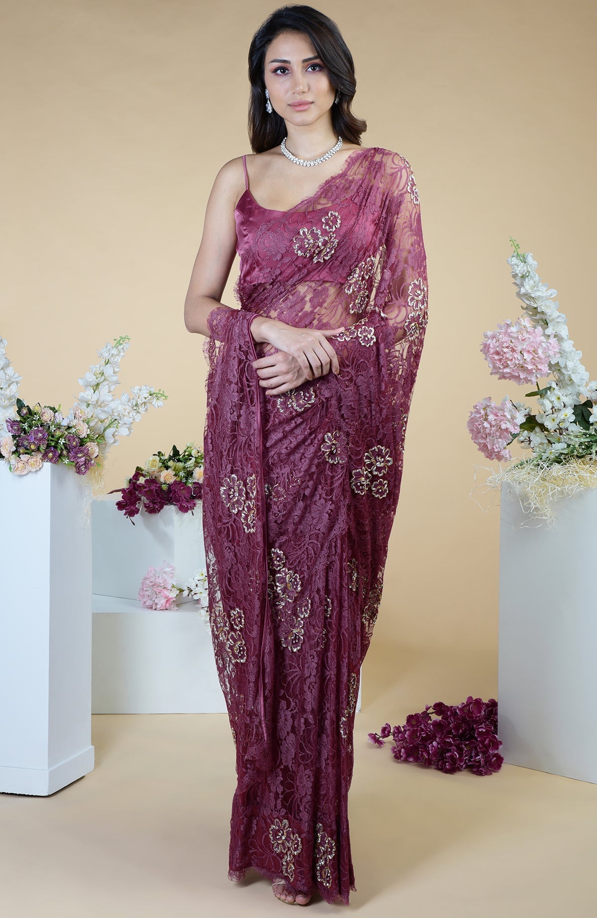 Wine French Chantilly saree with gold and silver hand embroidery.