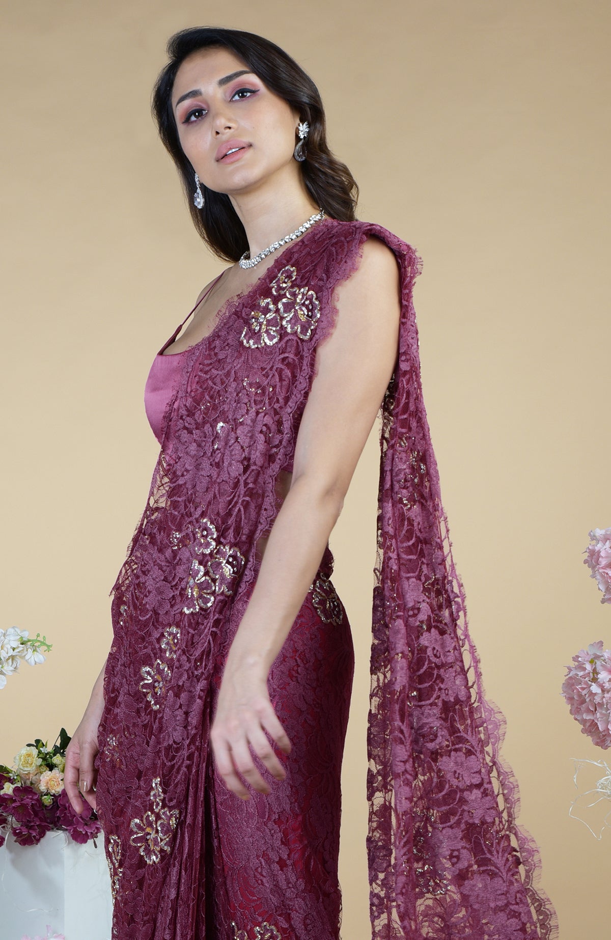Wine French Chantilly saree with gold and silver cut bead embroidery.