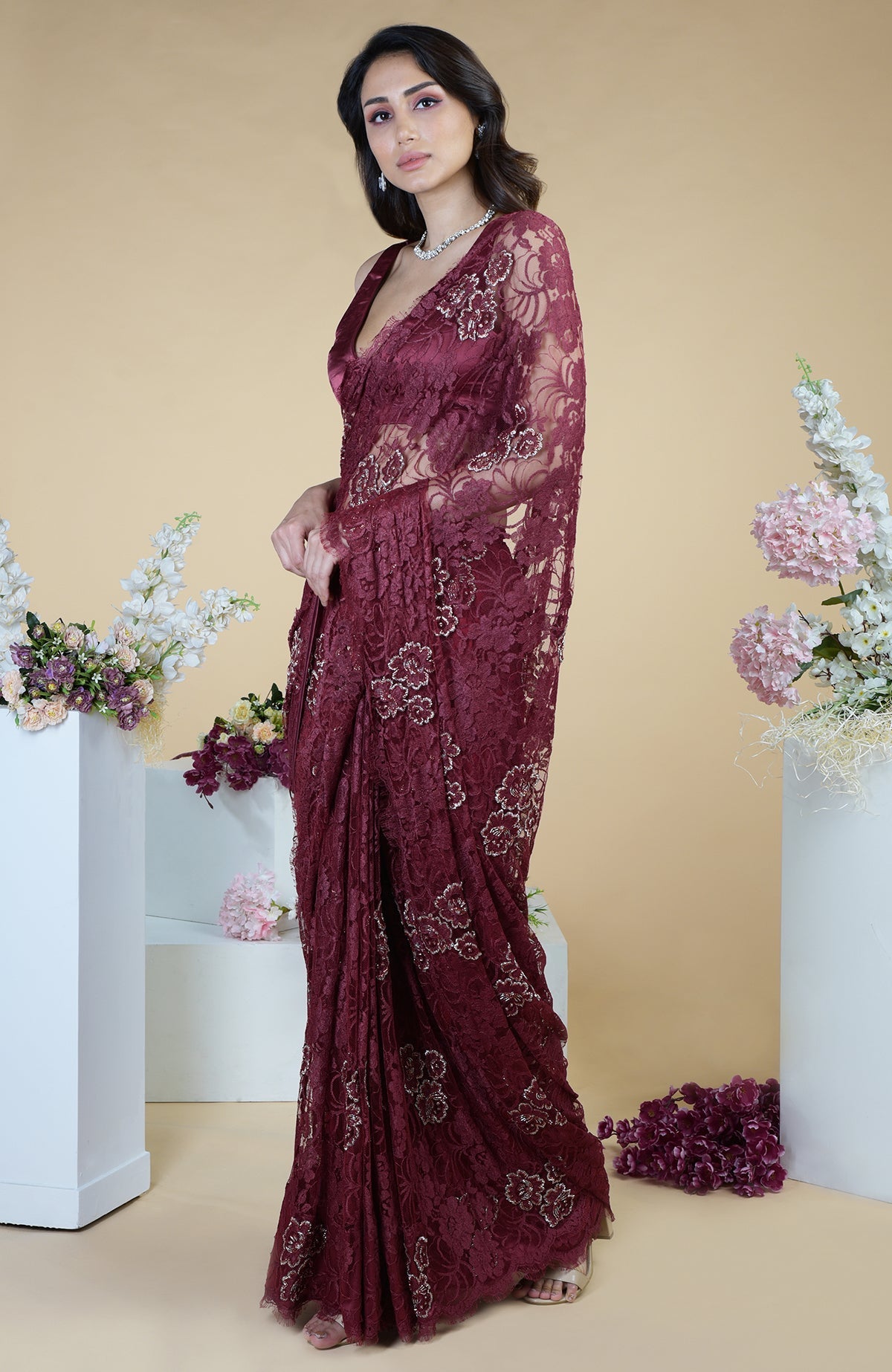 Burgundy French Chantilly hand-embroidered saree with floral motifs.