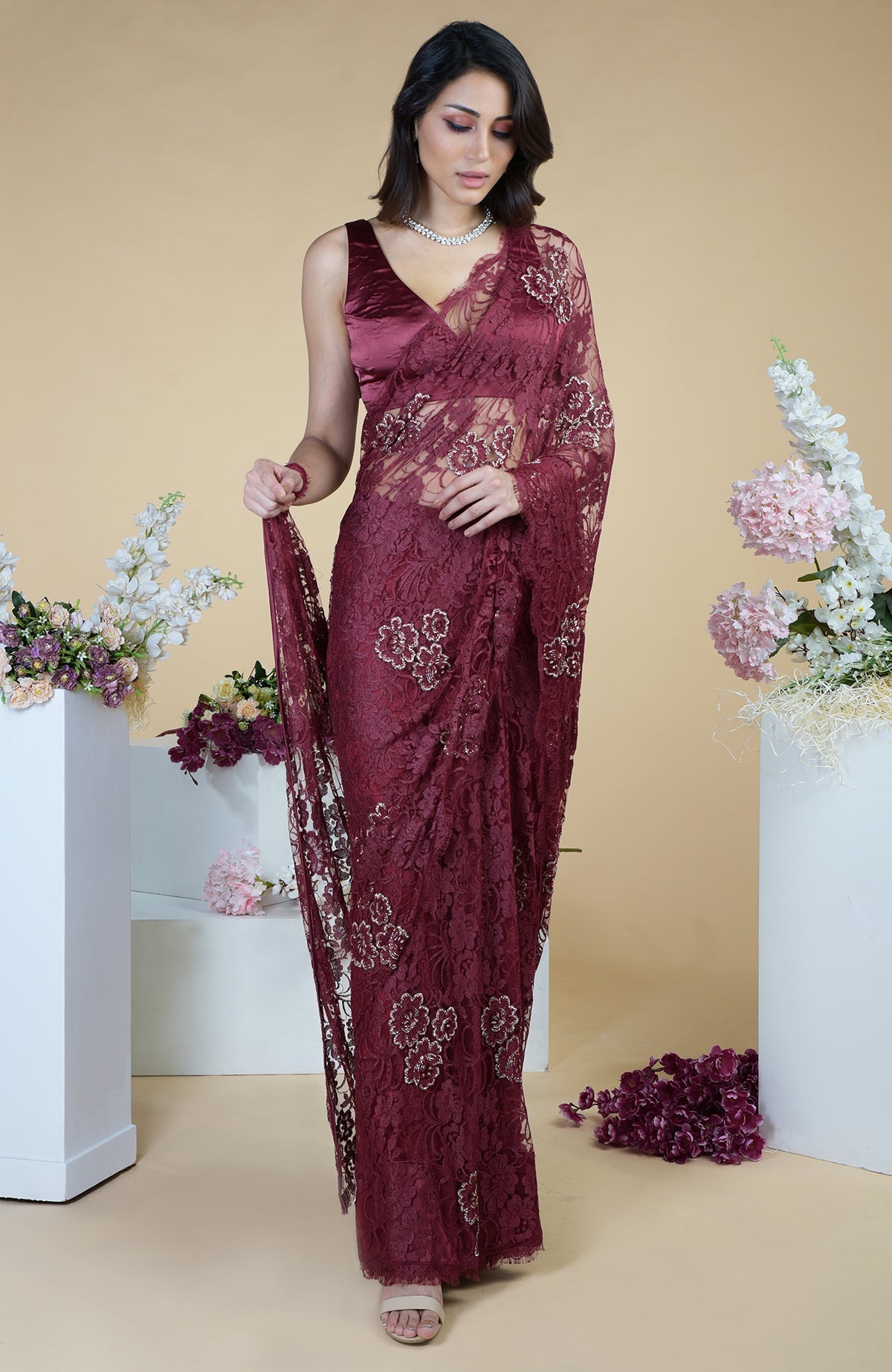 Burgundy French Chantilly hand embroidered saree with a matching satin blouse.