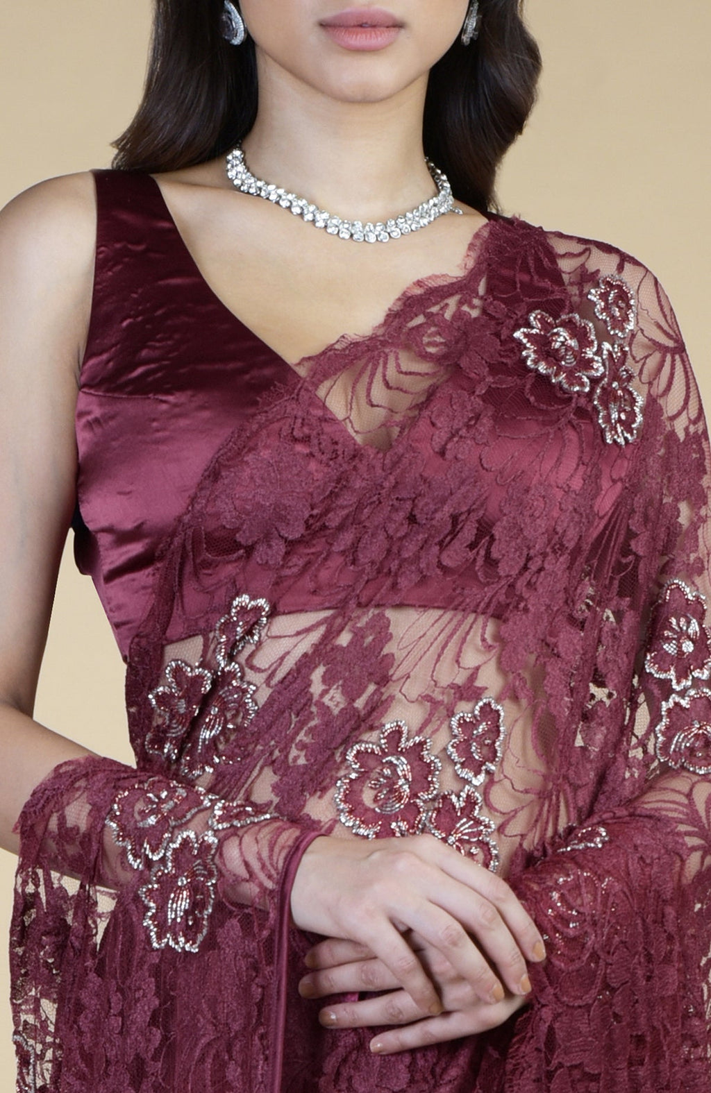 Burgundy French Chantilly hand embroidered saree with a satin blouse.