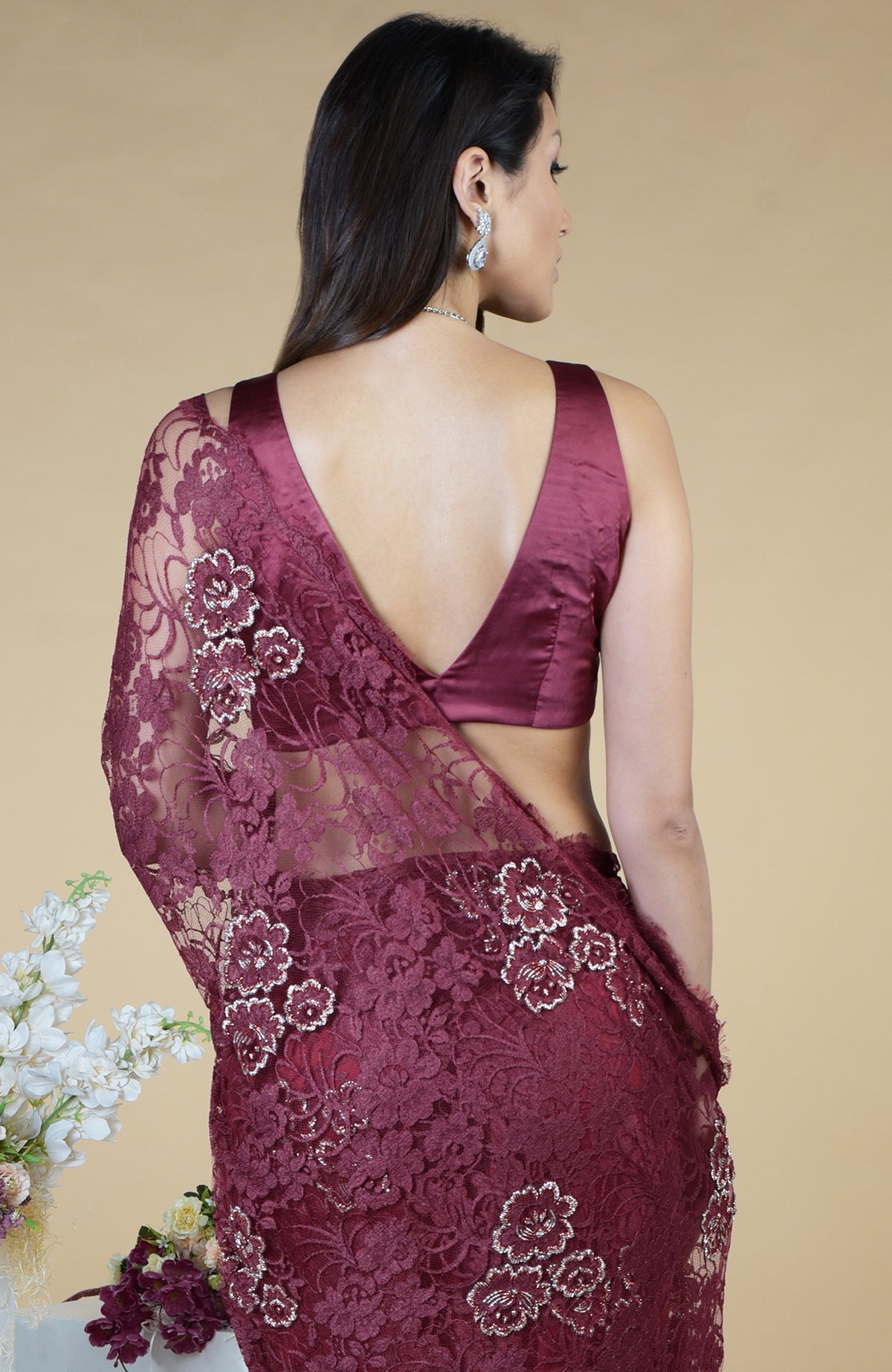 Burgundy French Chantilly hand embroidered saree with a deep V-neck blouse.