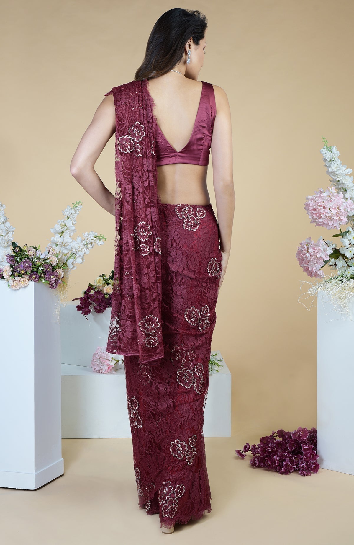 Burgundy French Chantilly hand-embroidered saree with a deep V-neck blouse.
