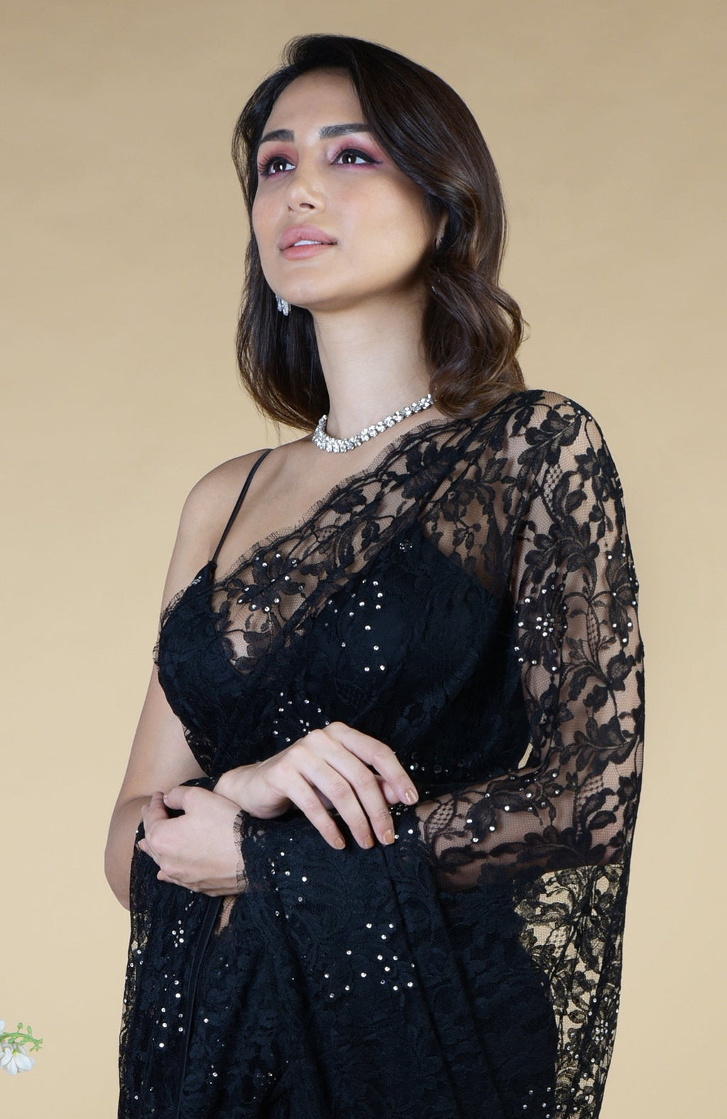 Black French Chantilly lace saree with Swarovski crystals and an embellished blouse.