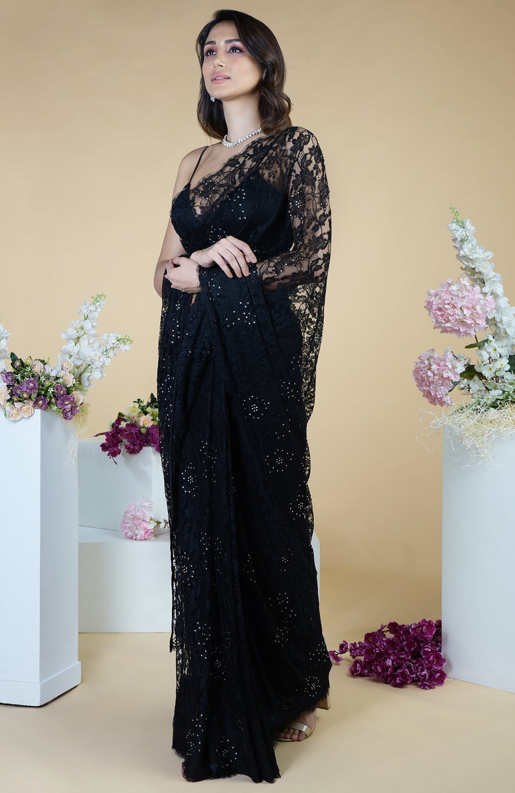 Black French Chantilly lace saree with Swarovski crystals and an embellished blouse.