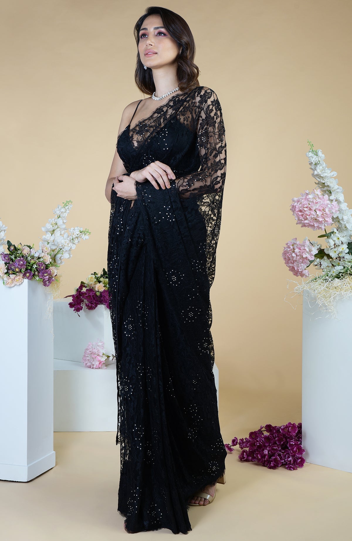 Black French Chantilly lace saree with Swarovski crystals and an embellished blouse.