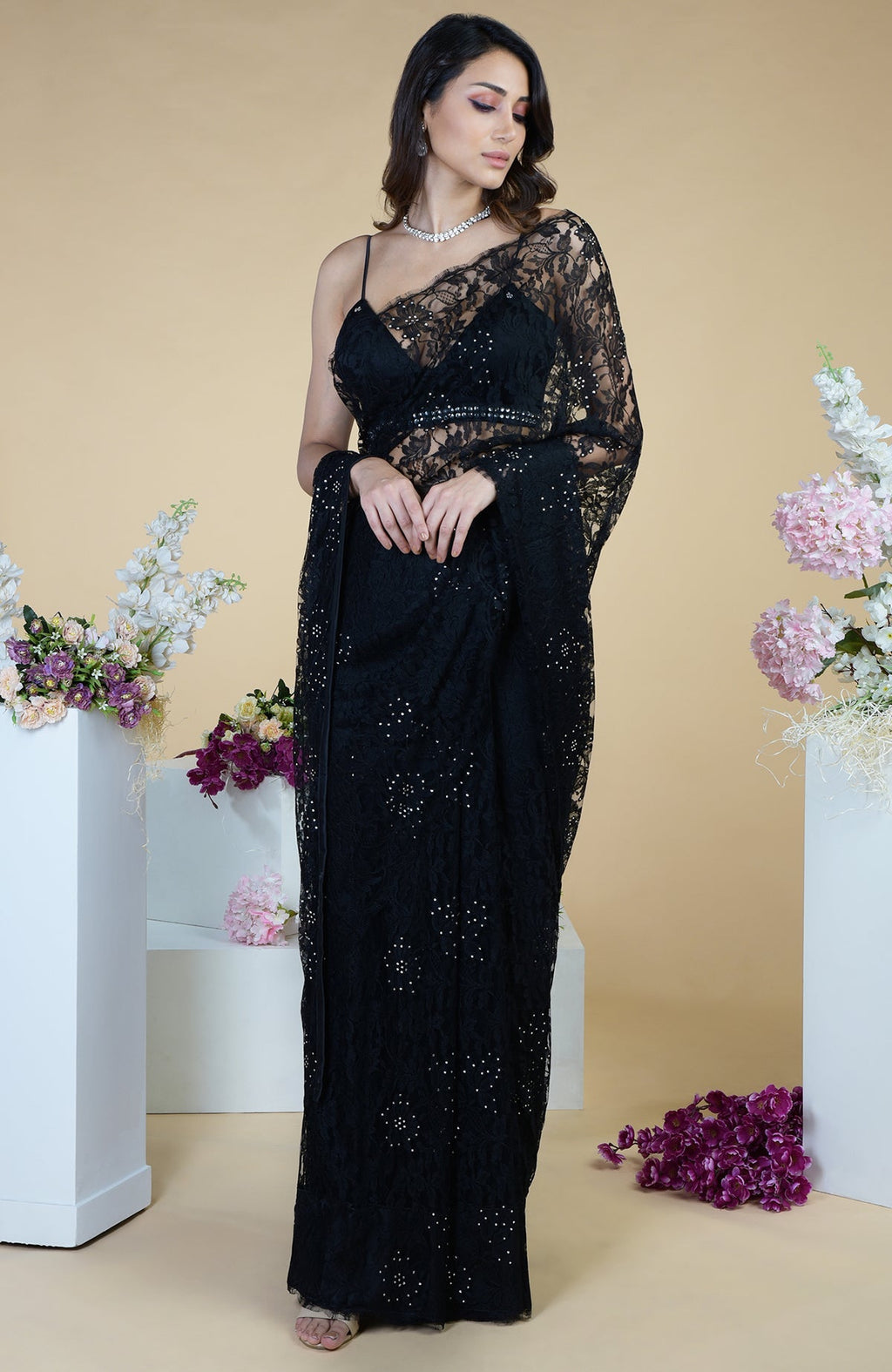 Black French Chantilly lace saree with Swarovski crystals and embellished blouse.