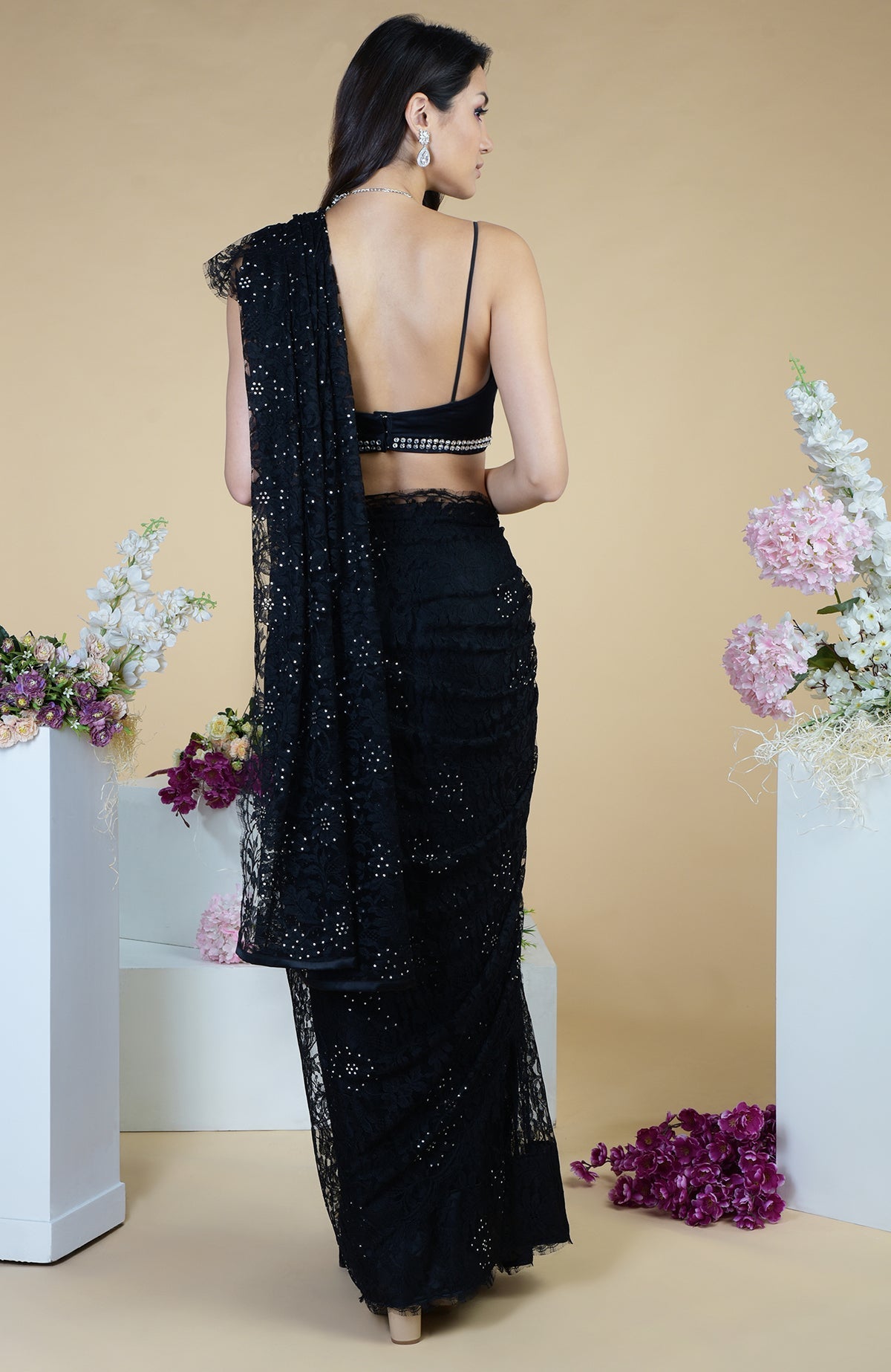 Black French Chantilly lace saree with Swarovski crystals and an embellished blouse.