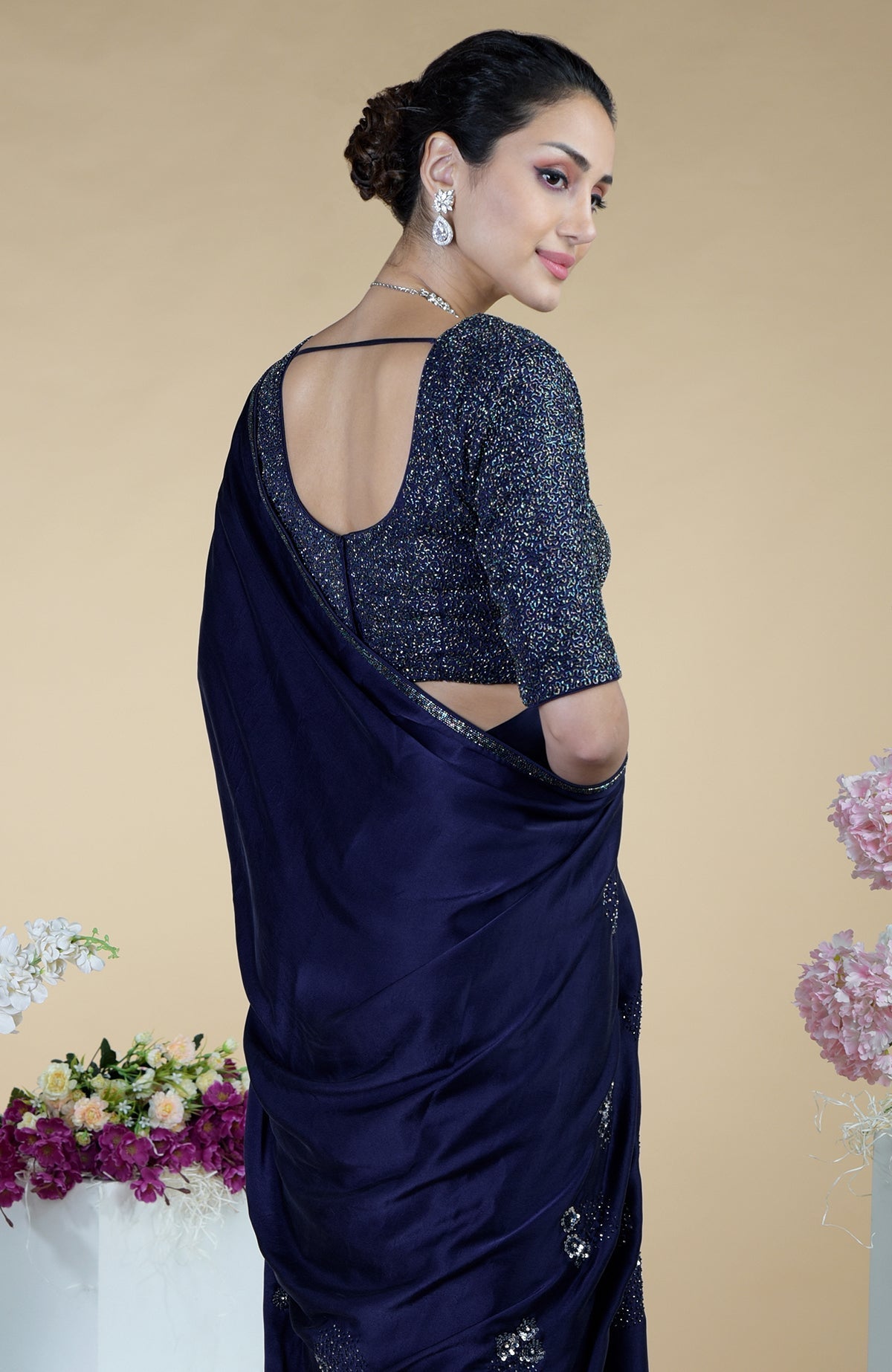 Midnight blue saree with a sequined blouse and beaded embroidery.