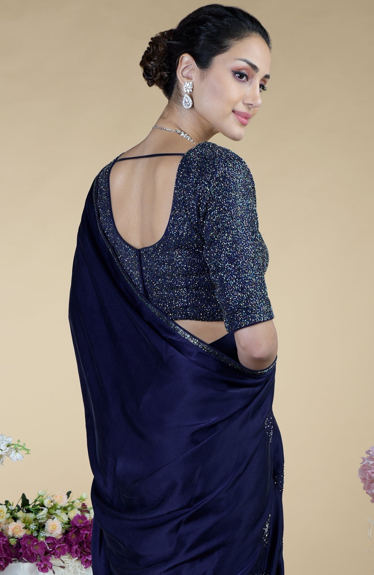 Woman in a midnight blue sequin blouse and matching saree.