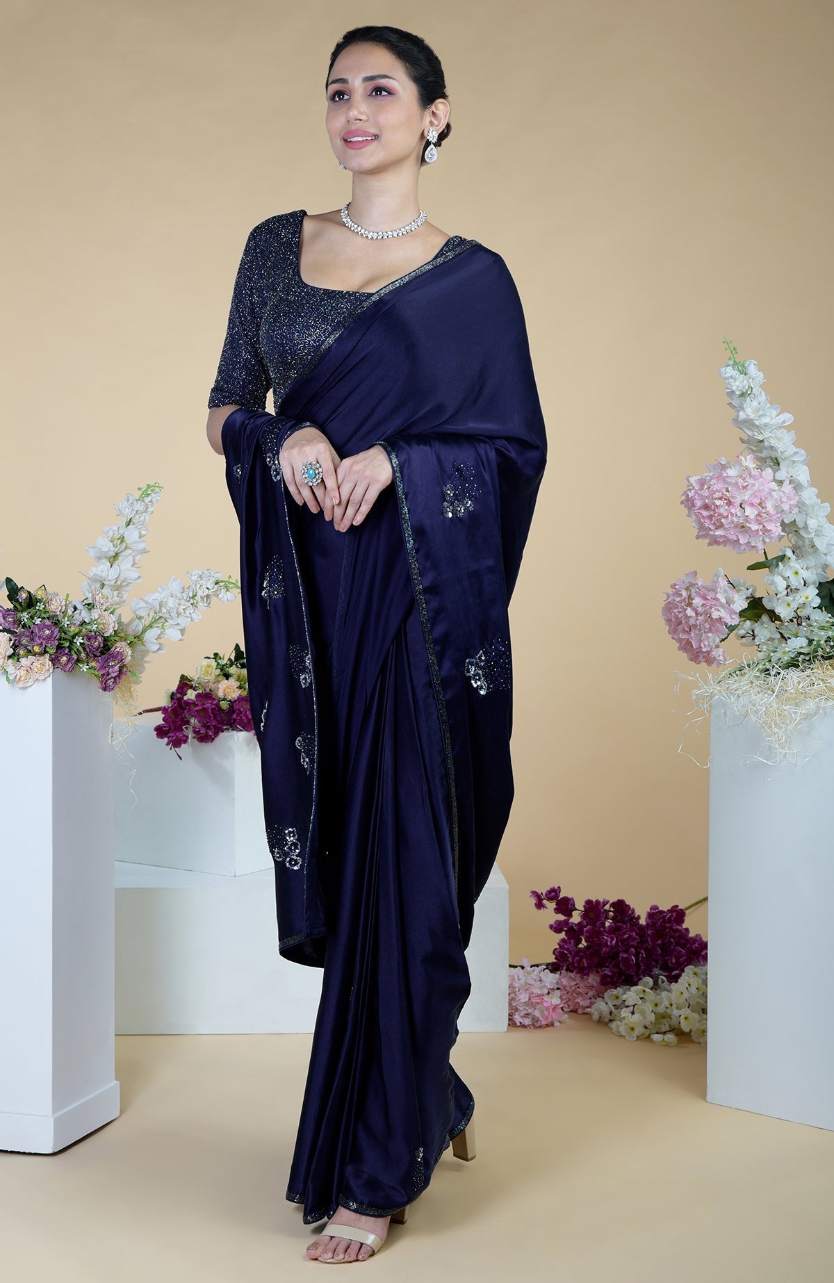 Midnight blue satin silk saree with bead and sequin embroidery.