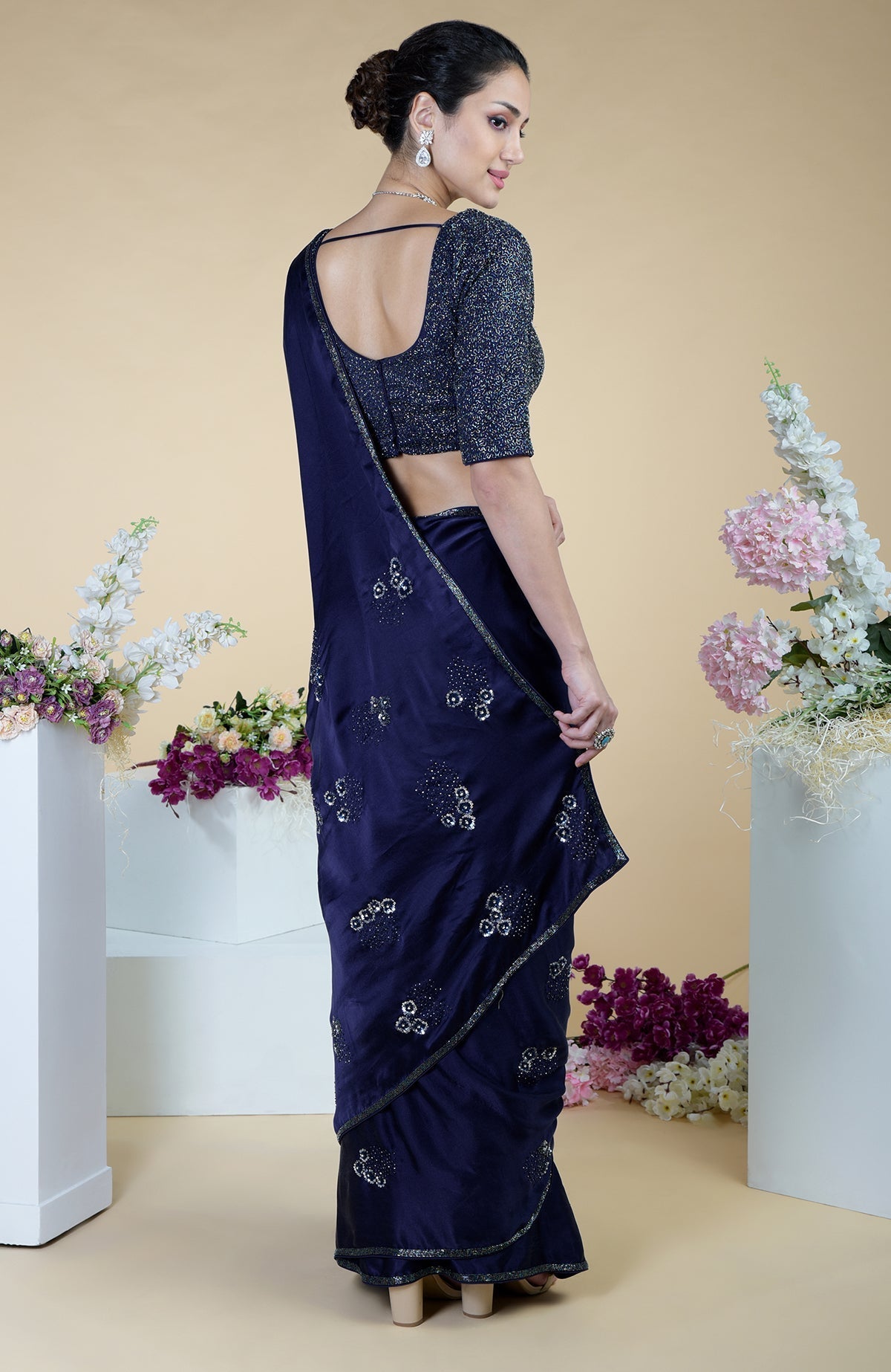 Midnight blue hand-embroidered saree with a matching sequin blouse.
