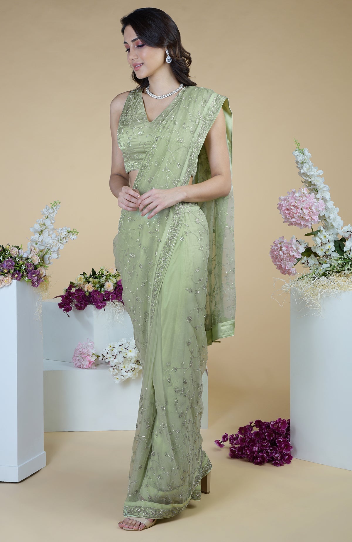 Pastel mint saree with silver beads and sequin zardozi hand embroidery.