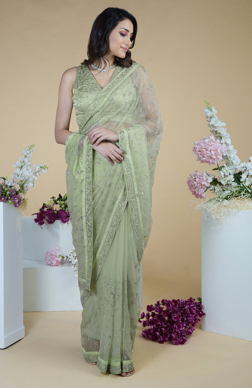 Pastel mint saree with silver beads and sequin zardozi hand embroidery.