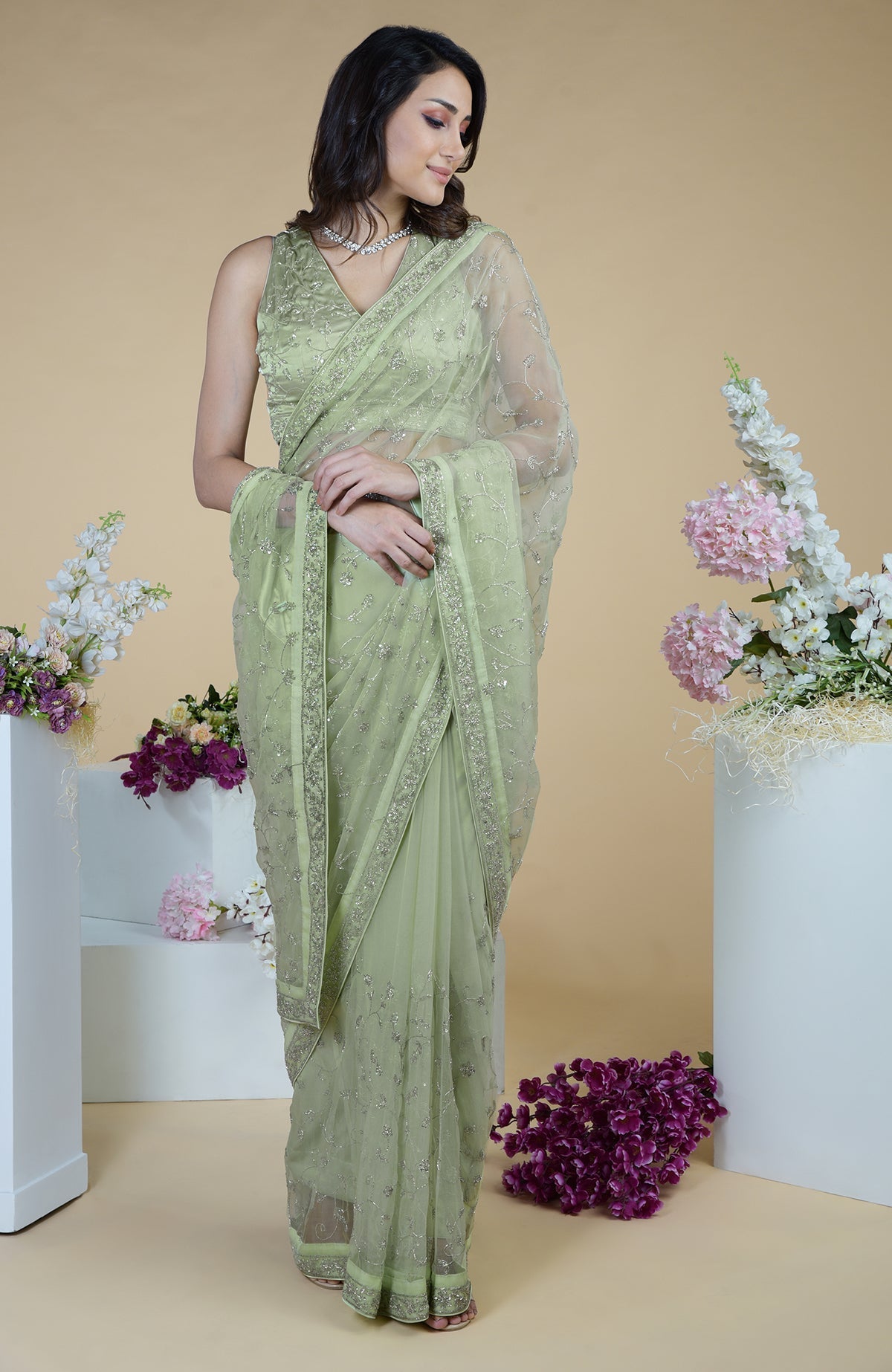 Pastel mint saree with silver beads and sequin zardozi hand embroidery.