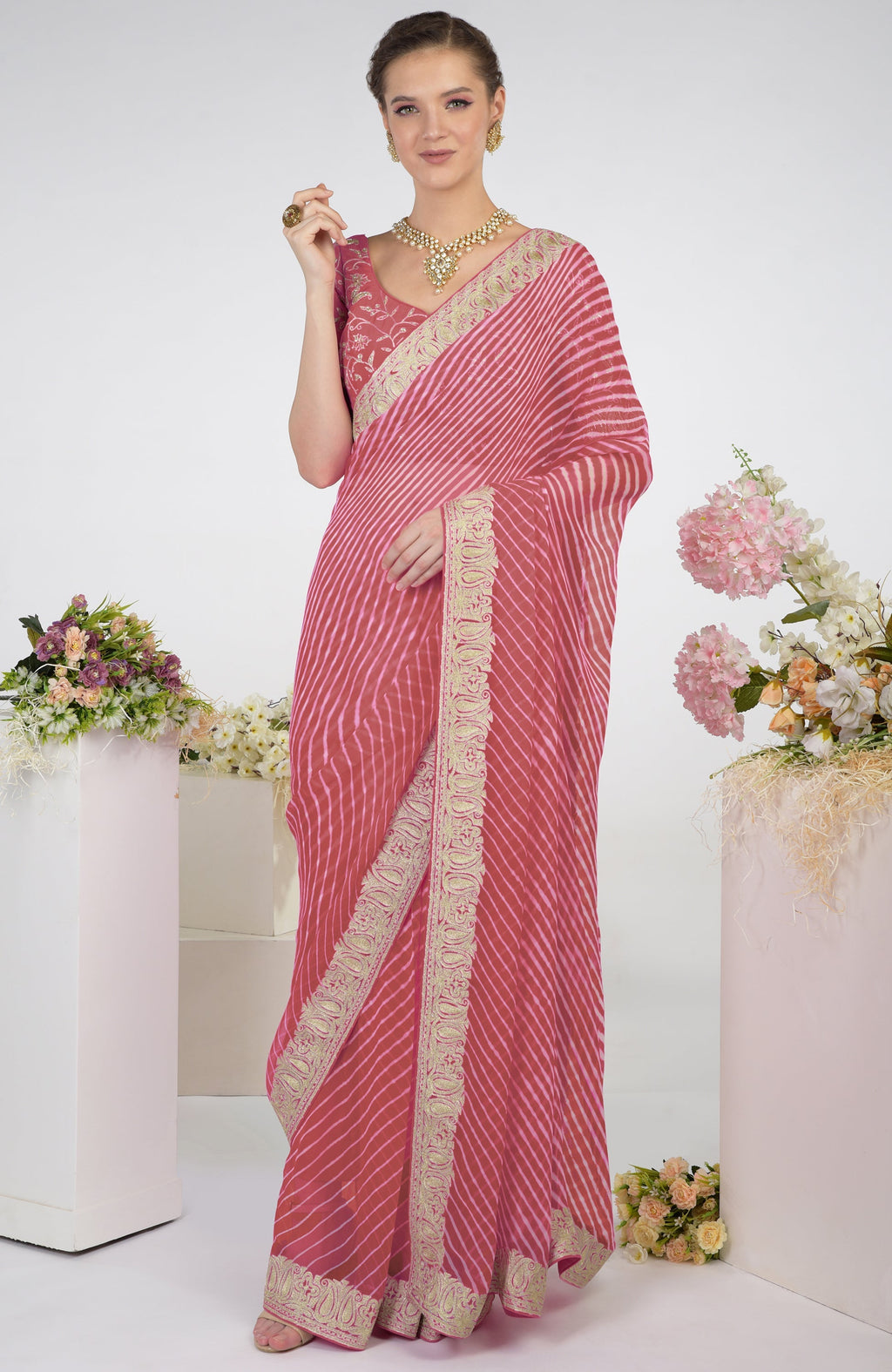 Garnet rose chiffon saree with leheriya pattern and silver paisley tilla aari embroidery.