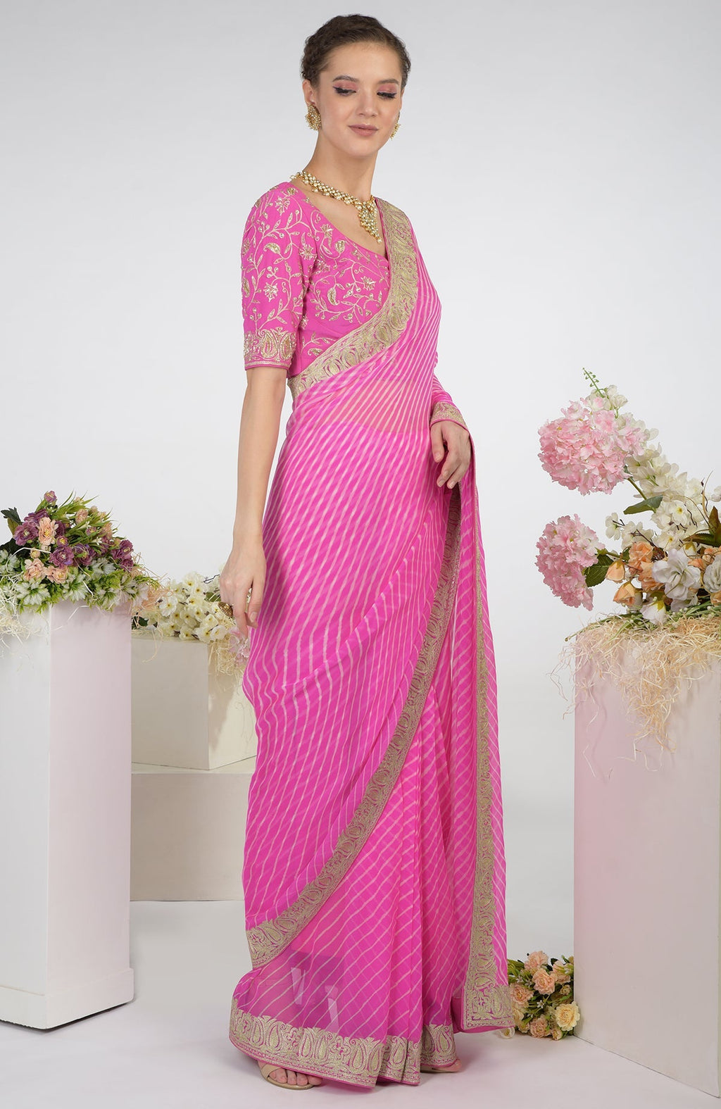 Pink leheriya Kashmiri paisley tilla aari embroidered saree with a matching blouse.