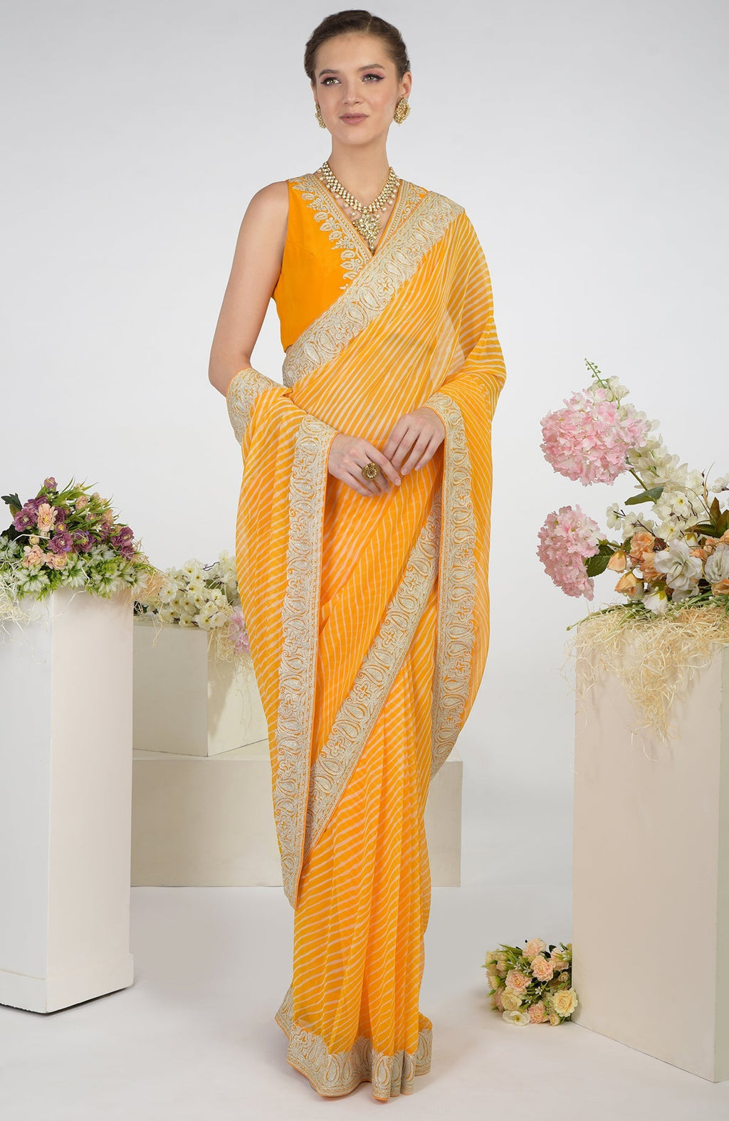Yellow leheriya chiffon saree with Kashmiri paisley tilla aari embroidery.