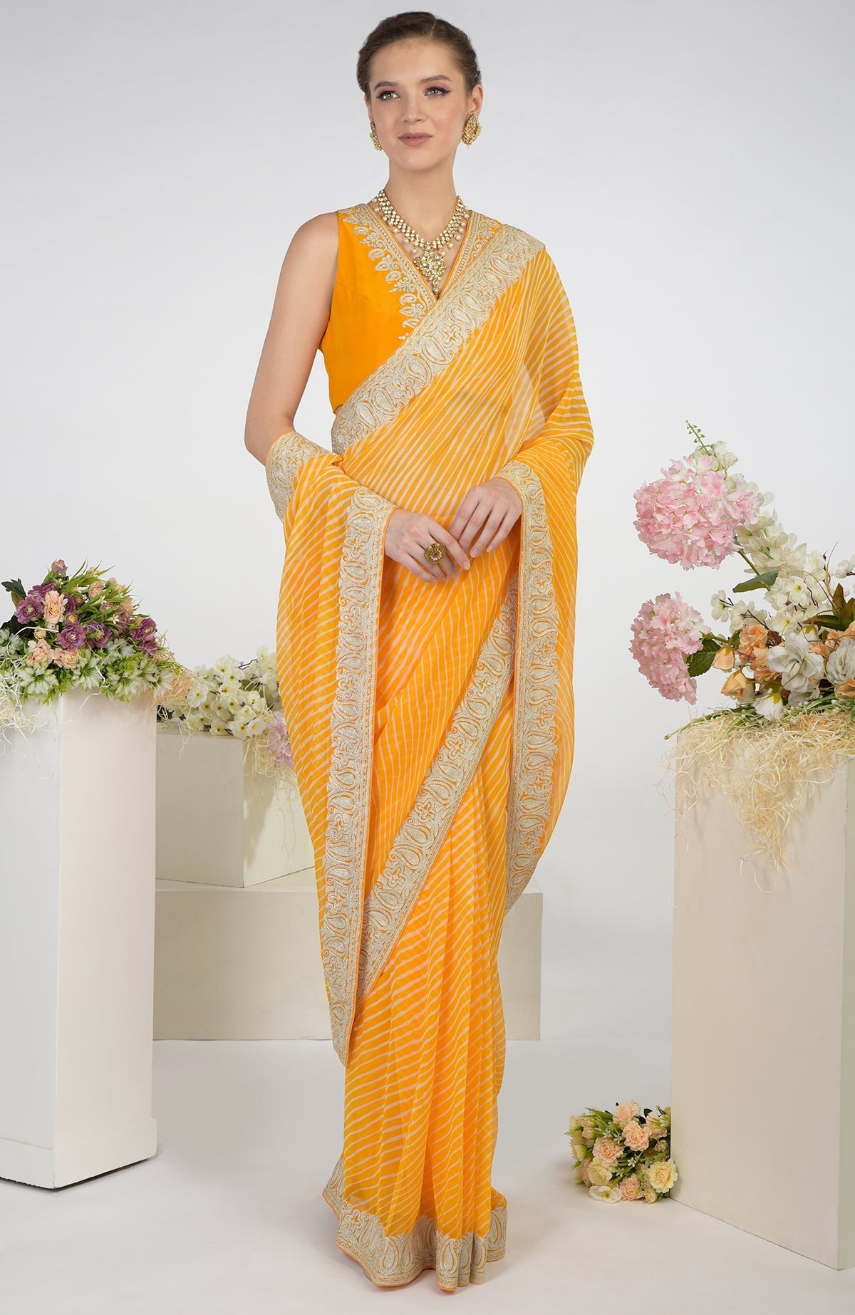 Yellow leheriya chiffon saree with Kashmiri paisley tilla aari embroidery.