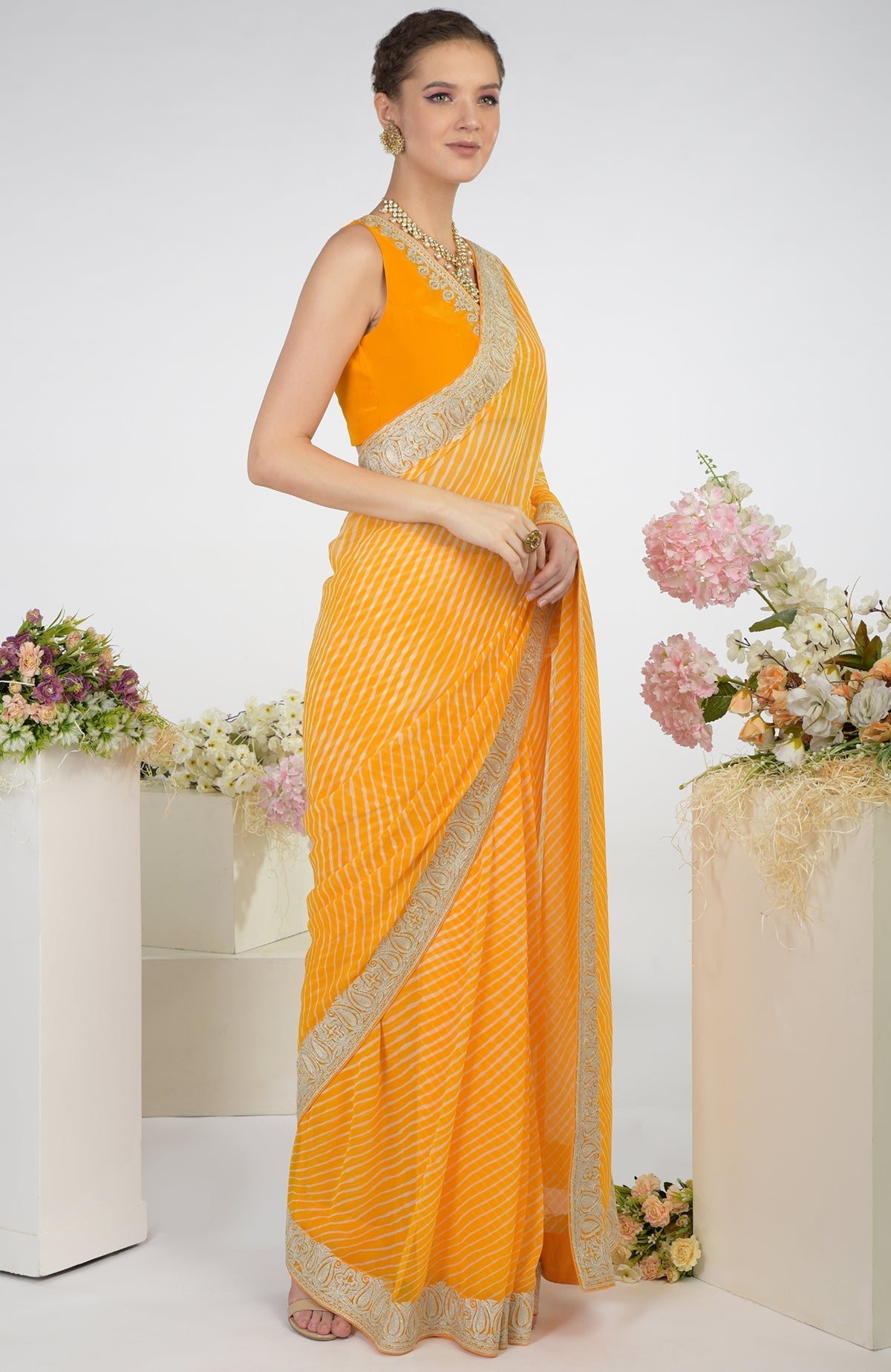 Yellow leheriya saree with Kashmiri paisley tilla aari embroidery.