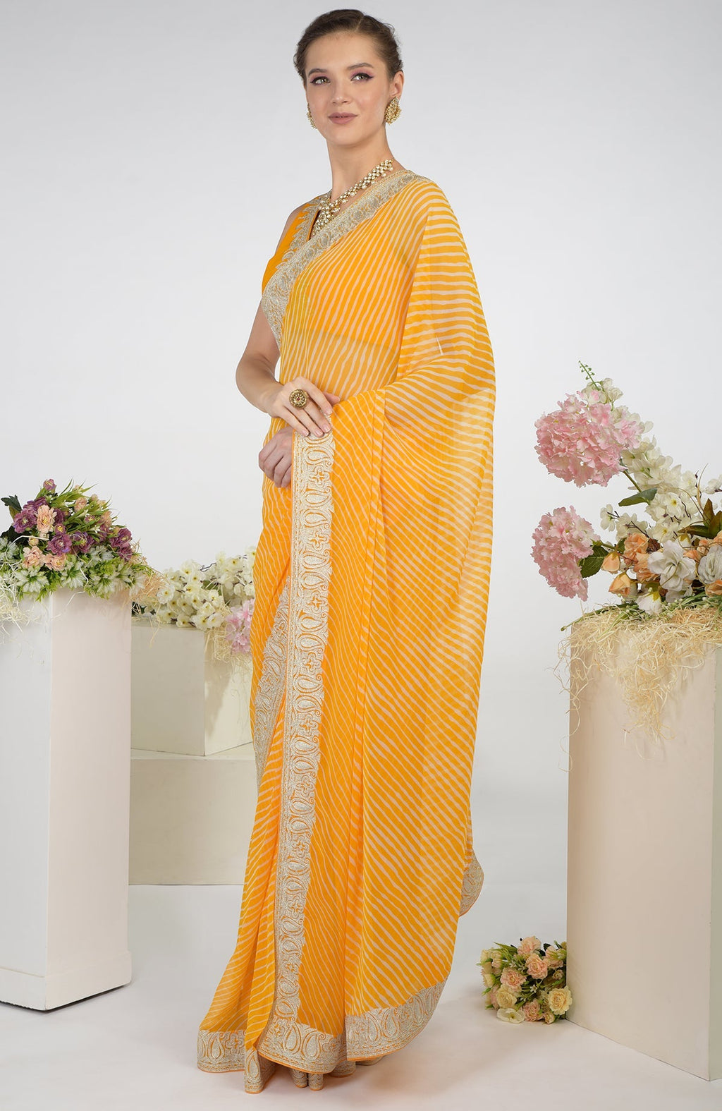 Yellow leheriya chiffon saree with Kashmiri paisley tilla aari embroidery.