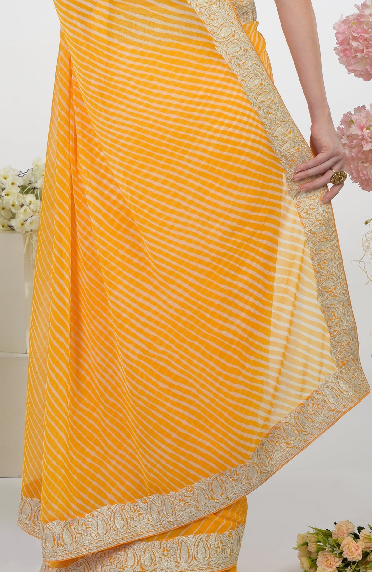 Yellow leheriya saree with Kashmiri paisley tilla aari embroidery.